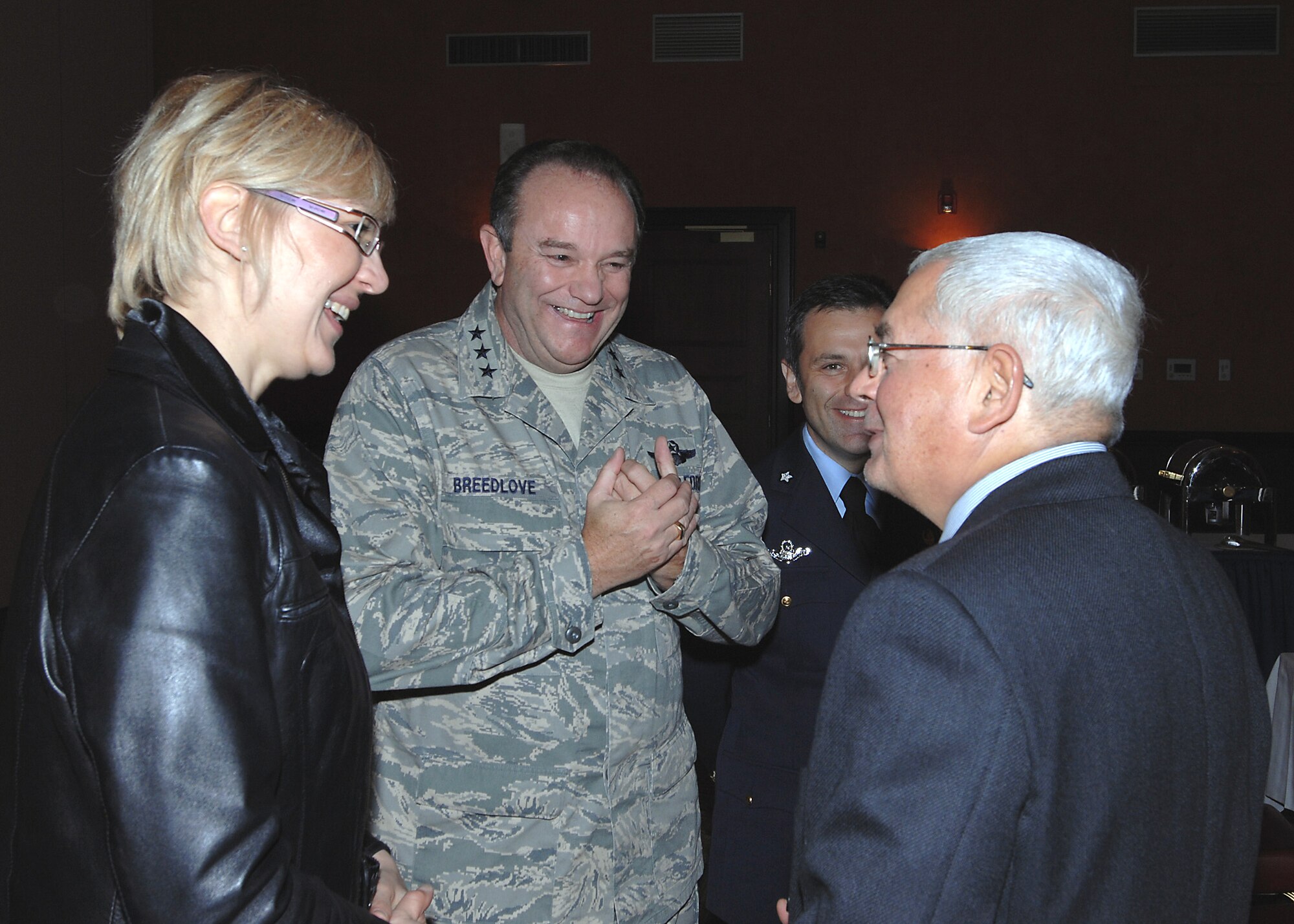 Lt. Gen. Phil Breedlove, 3rd Air Force commander shares a laugh with Doctor Elio Maria Landolfi (bottom right), the Prefect of Pordenone, during his visit to Aviano Air Base on Oct. 16, 2008. Col. Filippo Zampella (back), who recently took command of the Italian Air Force, "Pagliano e Gori" Airport here, and Ms. Monica Delrizzo, a 31st Fighter Wing Public Affairs specialist, also took part in the visit. General Breedlove previously commanded the wing at Aviano from June 2004 to June 2005. (U.S. Air Force photo/Tech. Sgt. Patrick R. Hyde)  