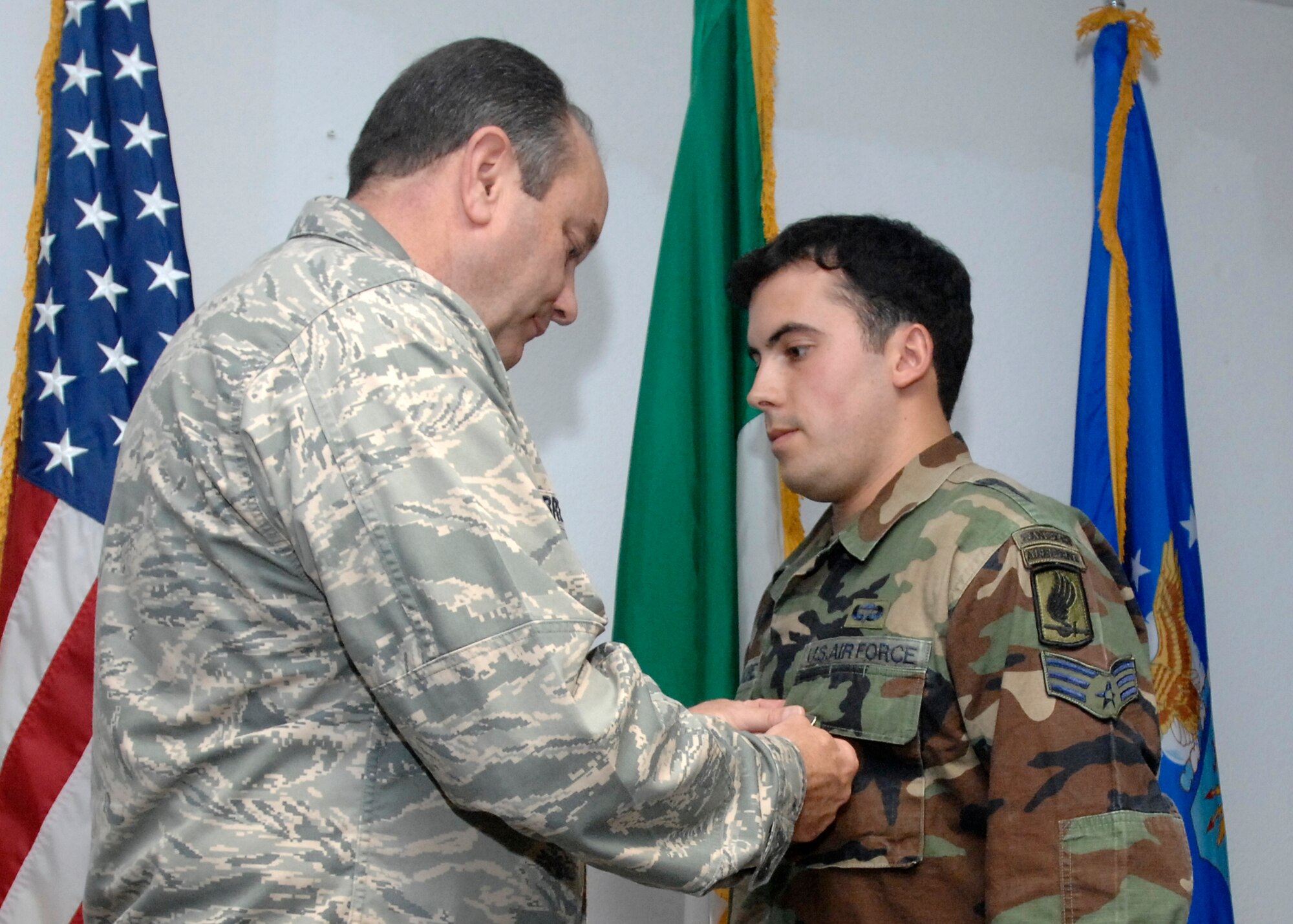 Senior Airman Gregory Predmore, an enlisted tactical air control party (TAC-P) for the 8th Air Support Operations Squadron commander, was presented the Air Force Combat Action Medal by Lt. Gen. Phil Breedlove for his actions while deployed with the Army in Afghanistan. General Breedlove is the 3rd Air Force commander and a former wing commander of the 31st Fighter Wing presented the medal during his visit to Aviano Air Base Oct. 16, 2008. (U.S. Air Force photo/Airman 1st Class Ashley Wood)