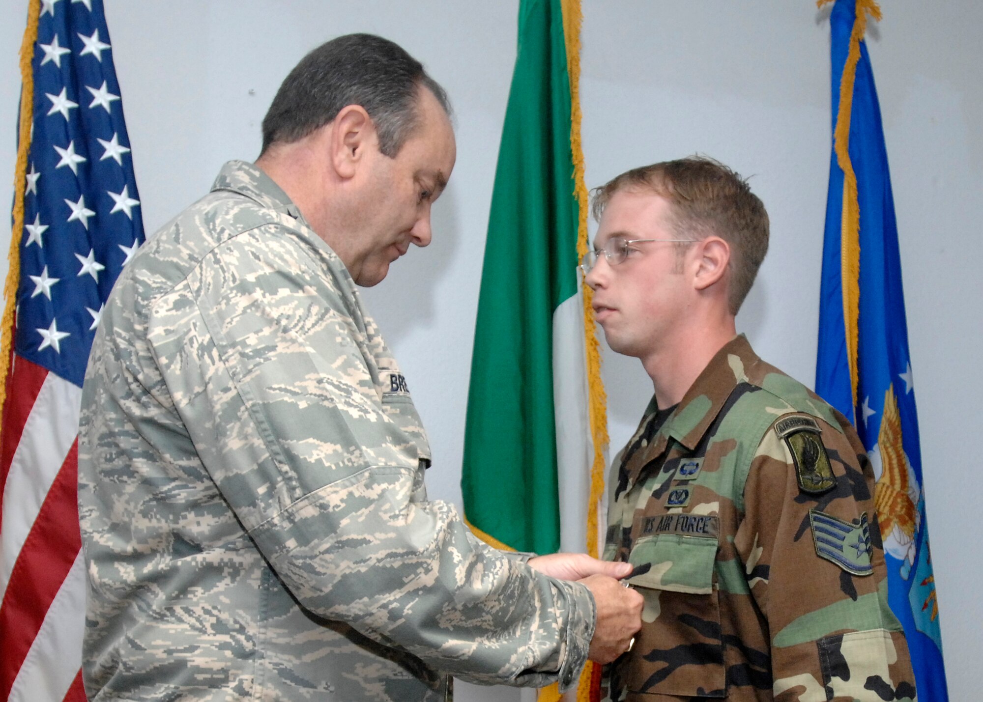 Staff Sgt. Joshua Ackerman, an enlisted tactical air control party (TAC-P) for the 8th Air Support Operations Squadron, was presented the Air Force Combat Action Medal by Lt. Gen. Phil Breedlove for his actions while deployed with the Army in Afghanistan. General Breedlove is the 3rd Air Force commander and a former wing commander of the 31st Fighter Wing presented the medal during his visit to Aviano Air Base Oct. 16, 2008. (U.S. Air Force photo/Airman 1st Class Ashley Wood)