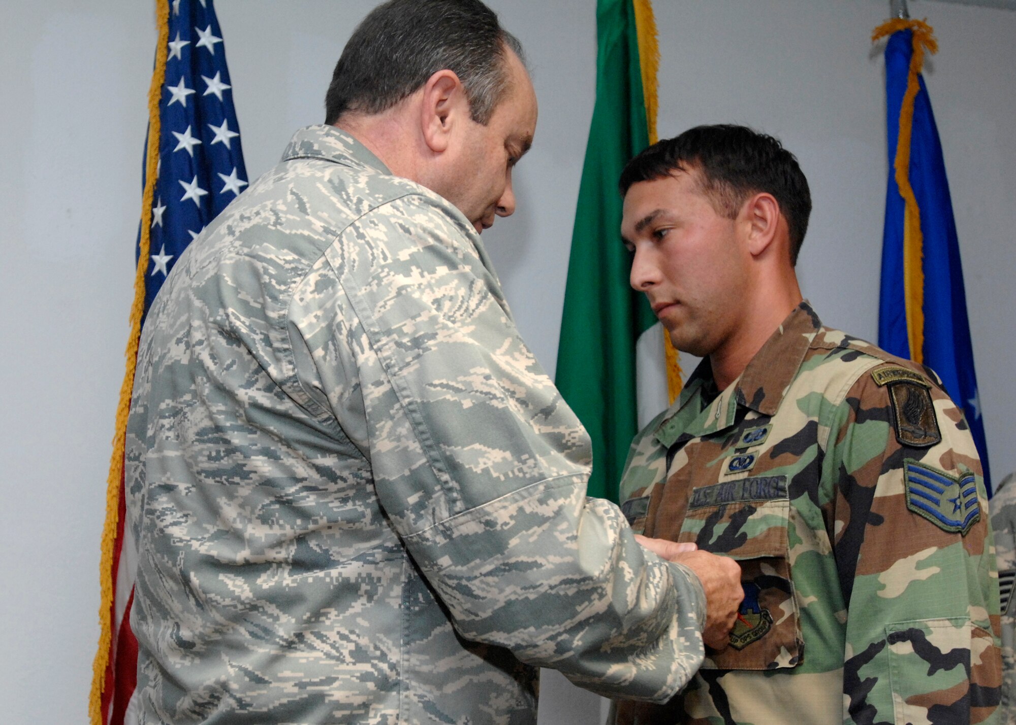 Staff Sgt. Gabriel Beck, an enlisted tactical air control party (TAC-P) for the 8th Air Support Operations Squadron commander, was presented the Air Force Combat Action Medal by Lt. Gen. Phil Breedlove for his actions while deployed with the Army in Afghanistan. General Breedlove is the 3rd Air Force commander and a former wing commander of the 31st Fighter Wing presented the medal during his visit to Aviano Air Base Oct. 16, 2008. (U.S. Air Force photo/Airman 1st Class Ashley Wood)
