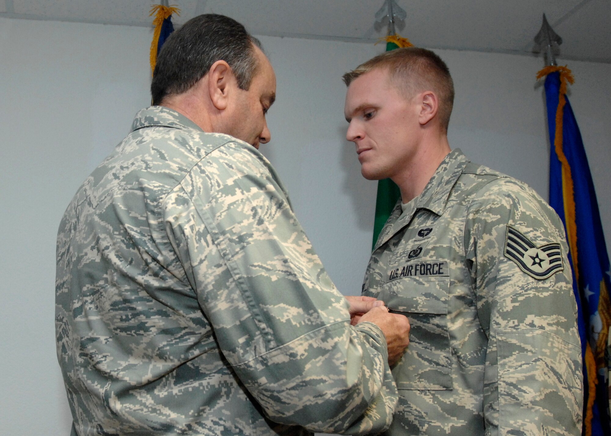 Staff Sgt. Kevin Krooner, an enlisted tactical air control party (TAC-P) for the 8th Air Support Operations Squadron commander, was presented the Bronze Star and Air Force Combat Action Medals by Lt. Gen. Phil Breedlove for his actions while deployed with the Army in Afghanistan. General Breedlove is the 3rd Air Force commander and a former wing commander of the 31st Fighter Wing presented the medal during his visit to Aviano Air Base Oct. 16, 2008. (U.S. Air Force photo/Airman 1st Class Ashley Wood)