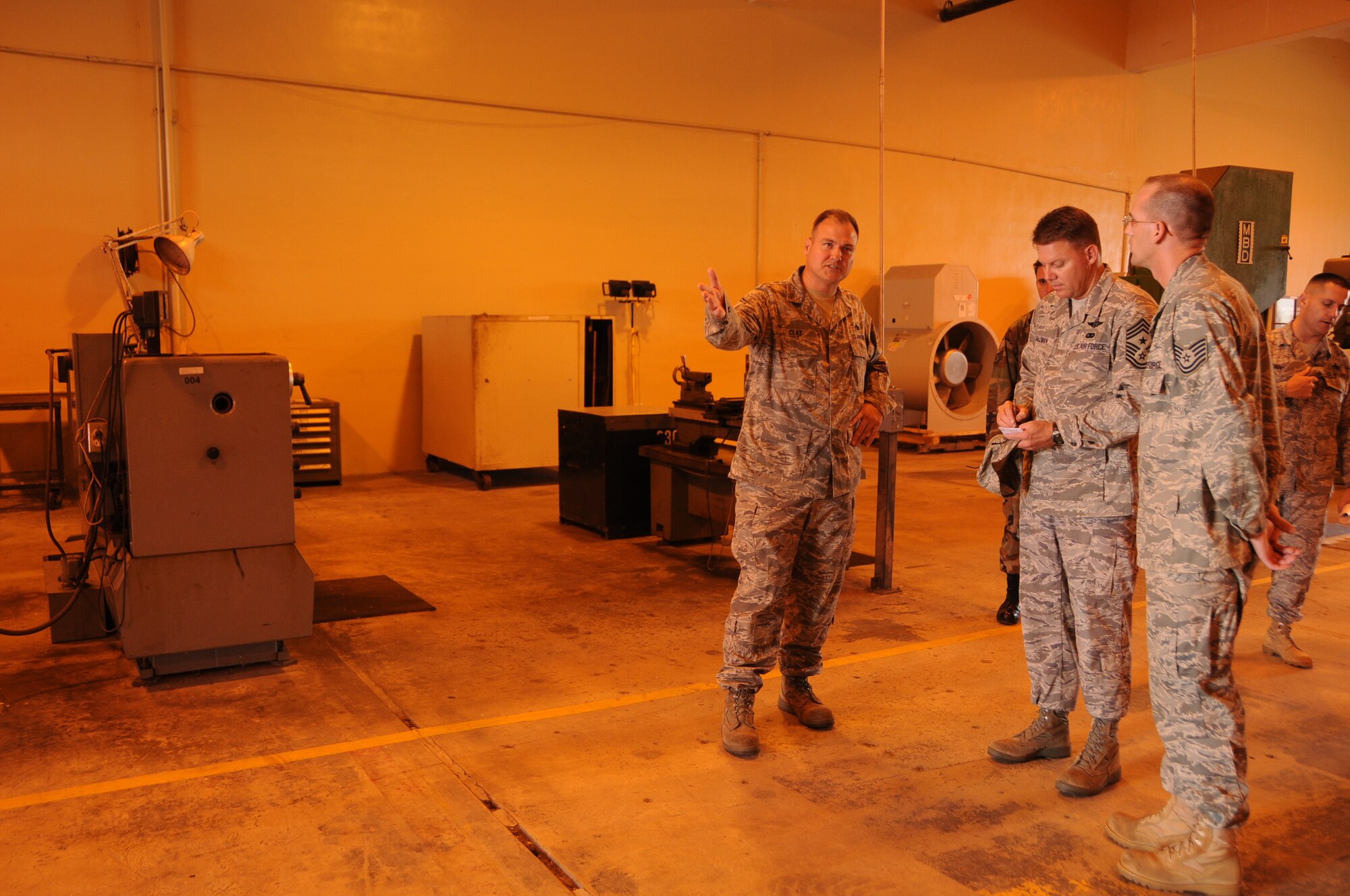 ANDERSEN AIR FORCE BASE, Guam - Senior Master Sgt. Clay of the 36th Maintenance Squadron, informs the 13th Air Force Command Chief Master Sgt. Todd Salzman the functions that the structual maintenance element performs here Oct. 16. Functions that the element perform are fabrication of sheet metal parts and installation of fasteners for aircraft. (U.S. Air Force photo by Airman 1st Class Courtney Witt)