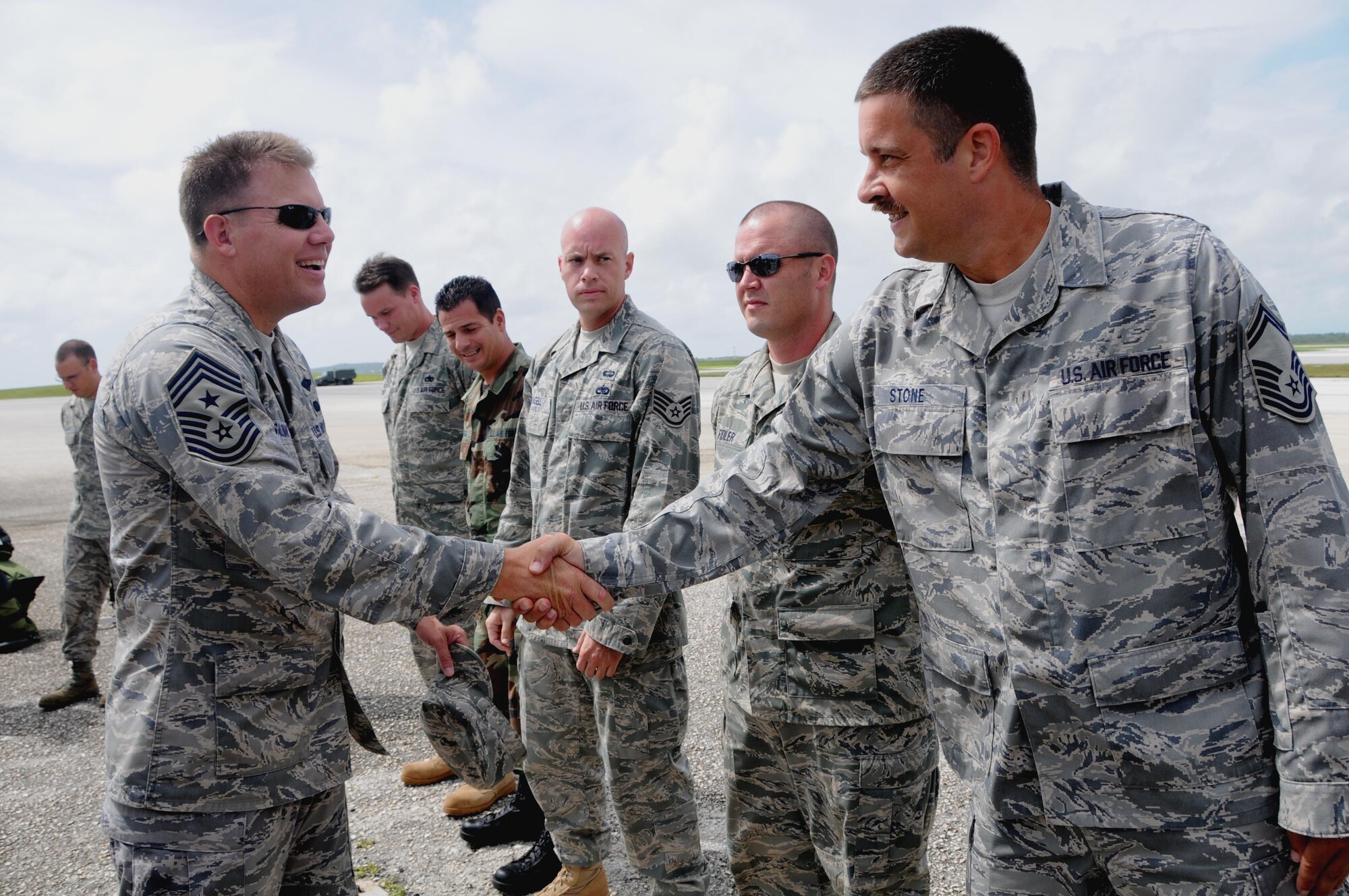 ANDERSEN AIR FORCE BASE, Guam - Thirteenth Air Force Command Chief Master Sgt. Todd Salzman greets Senior Master Sgt. Stone and other Airmen from 36th Mobility Response Squadron here Oct. 17 before receiving a briefing on the unit’s capabilities. The 36th MRS trains, organizes, equips and leads cross-functional forces providing initial Air Force presence to potentially austere forward operation locations as directed by the Pacific Air Forces commander. (U.S. Air Force photo by Airman 1st Class Courtney Witt)