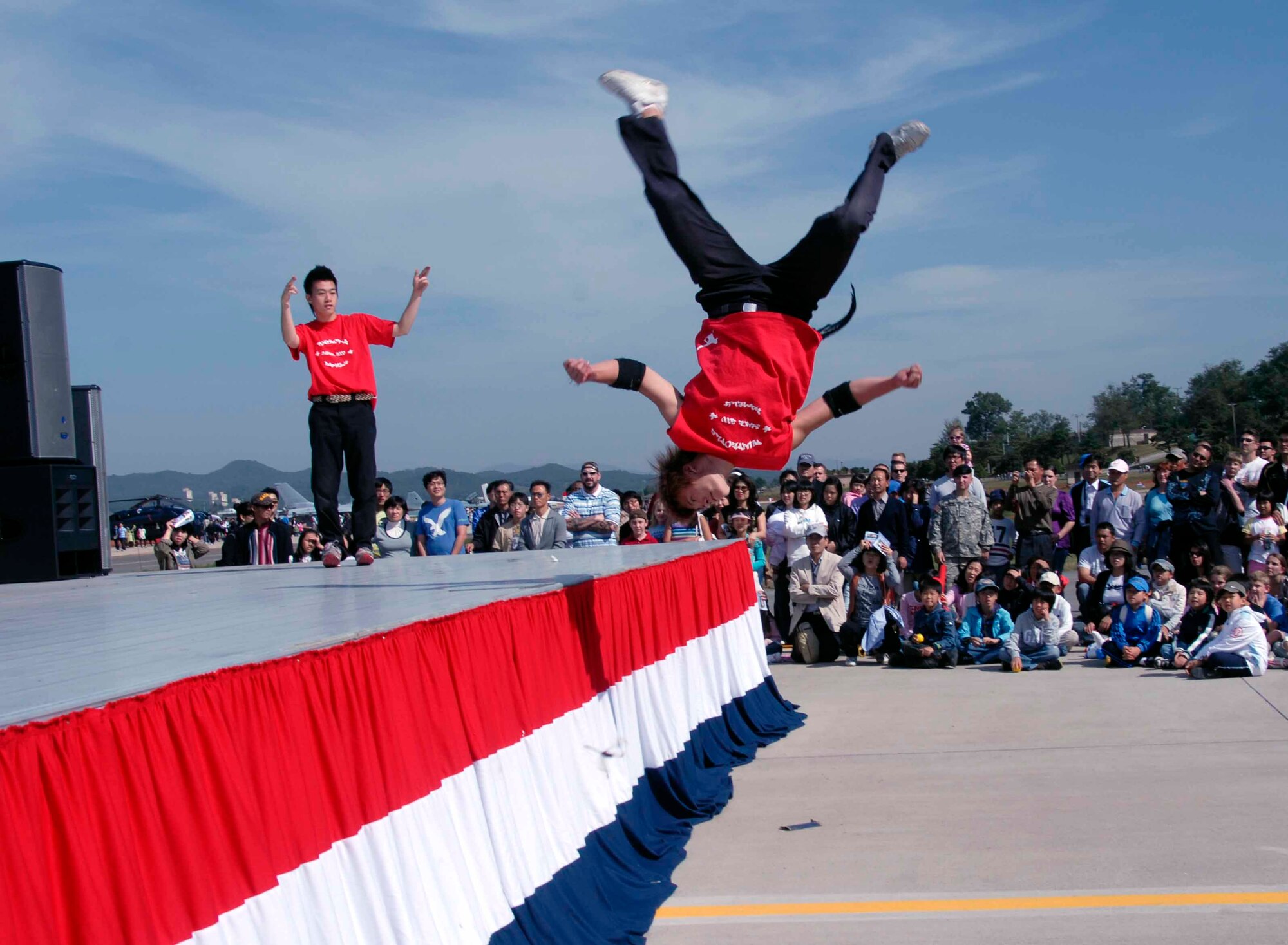 OSAN AIR BASE, Republic of Korea -- The dance troupe, B-Boys, entertains the crowd with their Hip-Hop dance routine during Air Power Day 2008. The two-day event also featured aerial demonstrations displaying the warfighting capabilities of the Republic of Korea and the United States aircraft, as well as static displays of the U.S. Army Patriot Missile System and various ROK Army Air Defense Artillery Systems. (U.S. Air Force photo/Staff Sgt. Candy Knight)