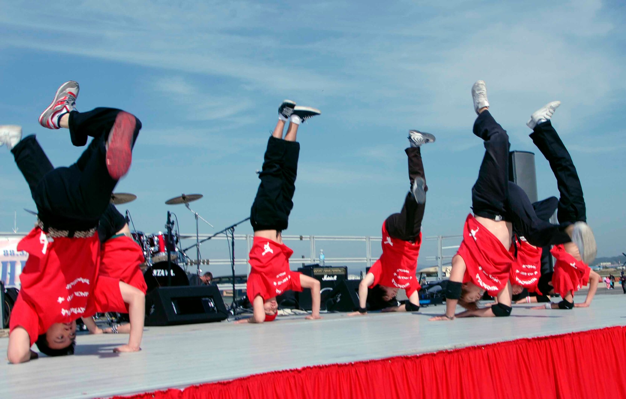 OSAN AIR BASE, Republic of Korea -- The dance troupe, B-Boys, entertains the crowd with their Hip-Hop dance routine during Air Power Day 2008. The two-day event also featured aerial demonstrations displaying the warfighting capabilities of the Republic of Korea and the United States aircraft, as well as static displays of the U.S. Army Patriot Missile System and various ROK Army Air Defense Artillery Systems. (U.S. Air Force photo/Staff Sgt. Candy Knight)