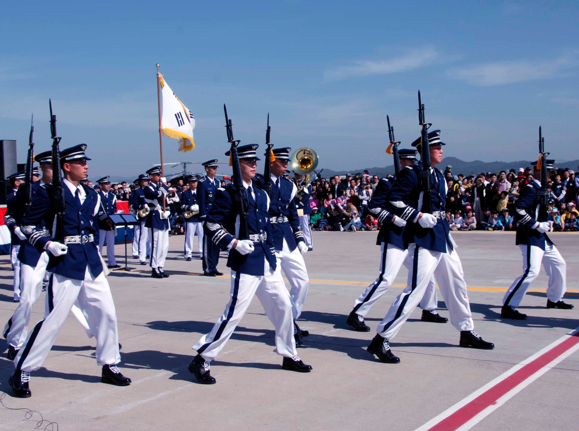 OSAN AIR BASE, Republic of Korea -- The ROKAF Honor Guard performs for the Air Power Day 2008 crowd. The two-day event also featured aerial demonstrations displaying the warfighting capabilities of the Republic of Korea and the United States aircraft, as well as static displays of the U.S. Army Patriot Missile System and various ROK Army Air Defense Artillery Systems. (U.S. Air Force photo/Staff Sgt. Candy Knight)