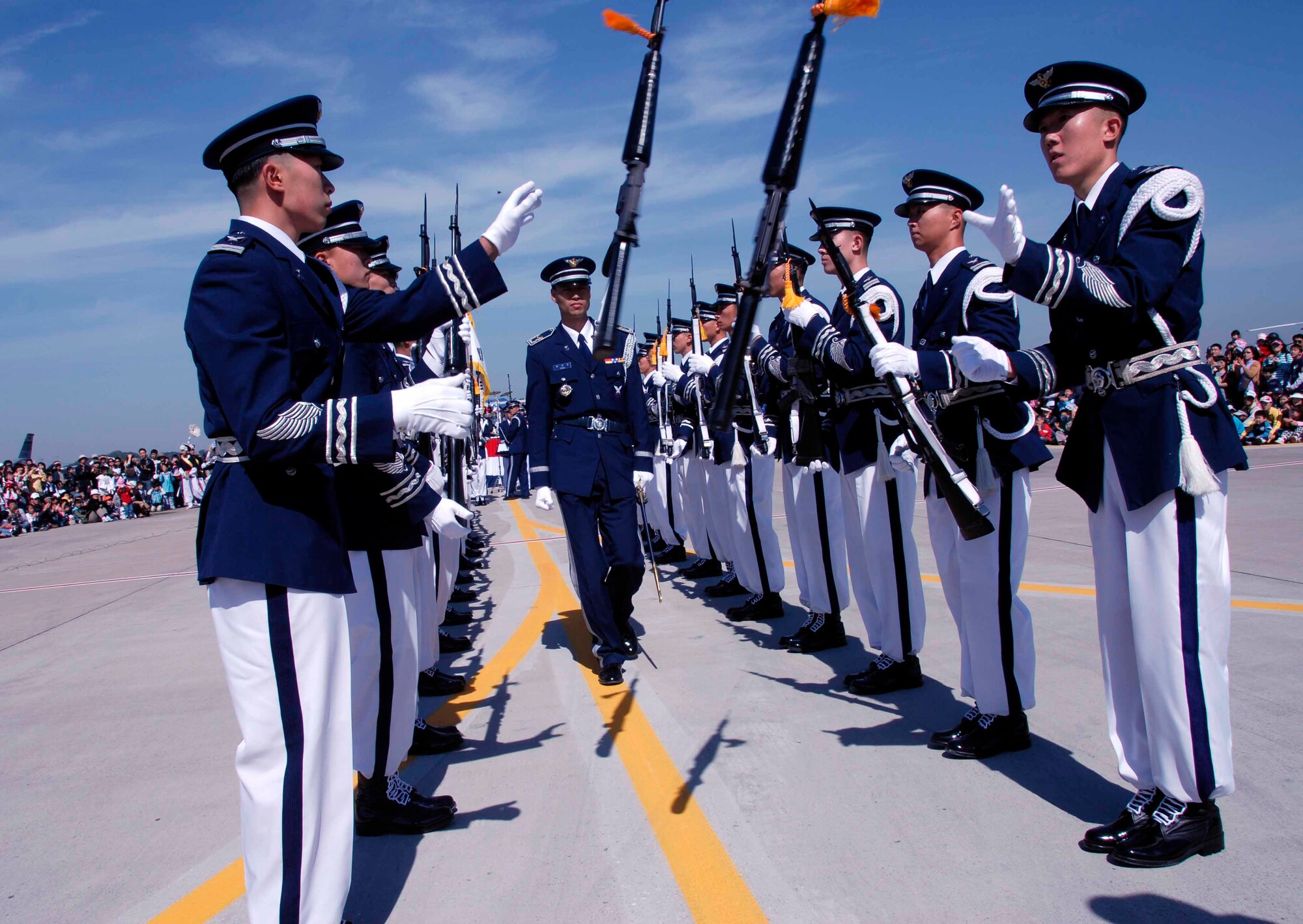 OSAN AIR BASE, Republic of Korea -- The ROKAF Honor Guard performs for the Air Power Day 2008 crowd. The two-day event also featured aerial demonstrations displaying the warfighting capabilities of the Republic of Korea and the United States aircraft, as well as static displays of the U.S. Army Patriot Missile System and various ROK Army Air Defense Artillery Systems. (U.S. Air Force photo/Staff Sgt. Candy Knight)