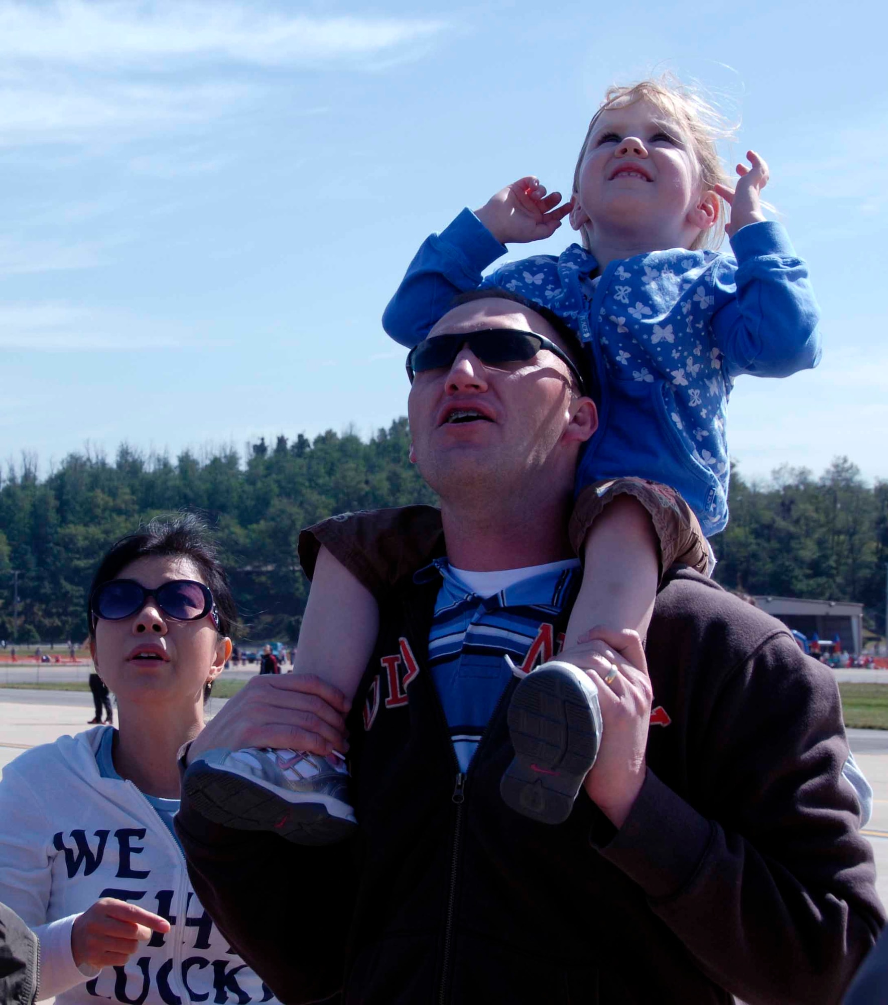 OSAN AIR BASE, Republic of Korea -- Spectators watch an aerial demonstration during Air Power Day 2008. The event featured aerial demonstrations of the A-10 “Thunderbolt II,” F-16 “Fighting Falcon,” U-2 “Dragon Lady,” the ROKAF F-4 “Phantom” and TA-50 “Golden Eagle" aircraft. (U.S. Air Force photo/Staff Sgt. Candy Knight)
