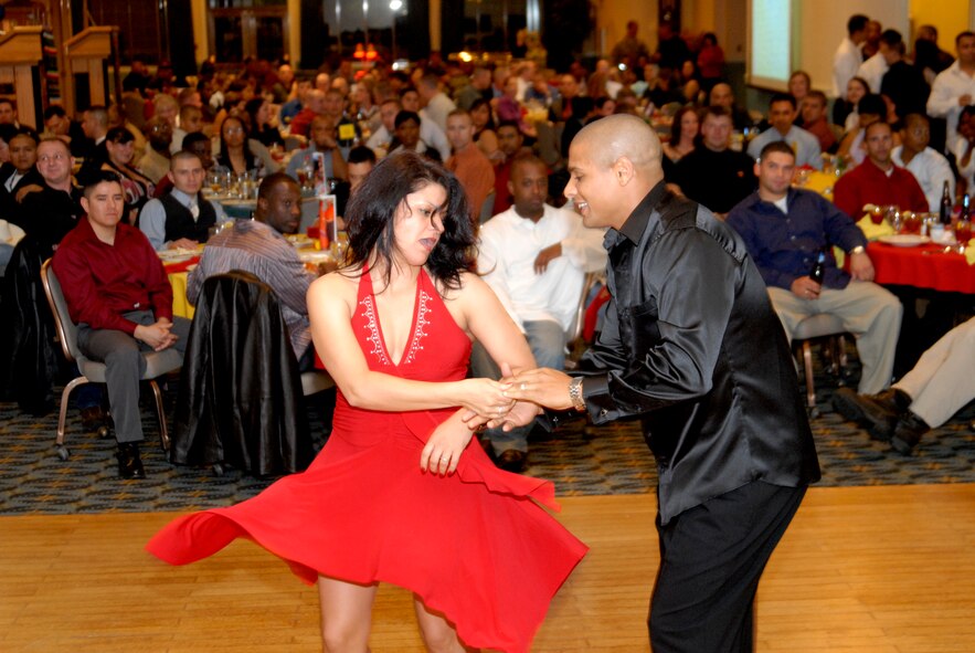 Staff Sgt. Marijuana Dominguez, a dancer from Osan Air Base, Republic of Korea, dances with her partner at the Hispanic Heritage Dinner, Kunsan Air Base Oct. 10. Sergeant Dominguez, from Guadalajara, Mexico, helped to entertain more than 180 people. (U.S. Air Force photo/Staff Sgt. Jason Colbert)
