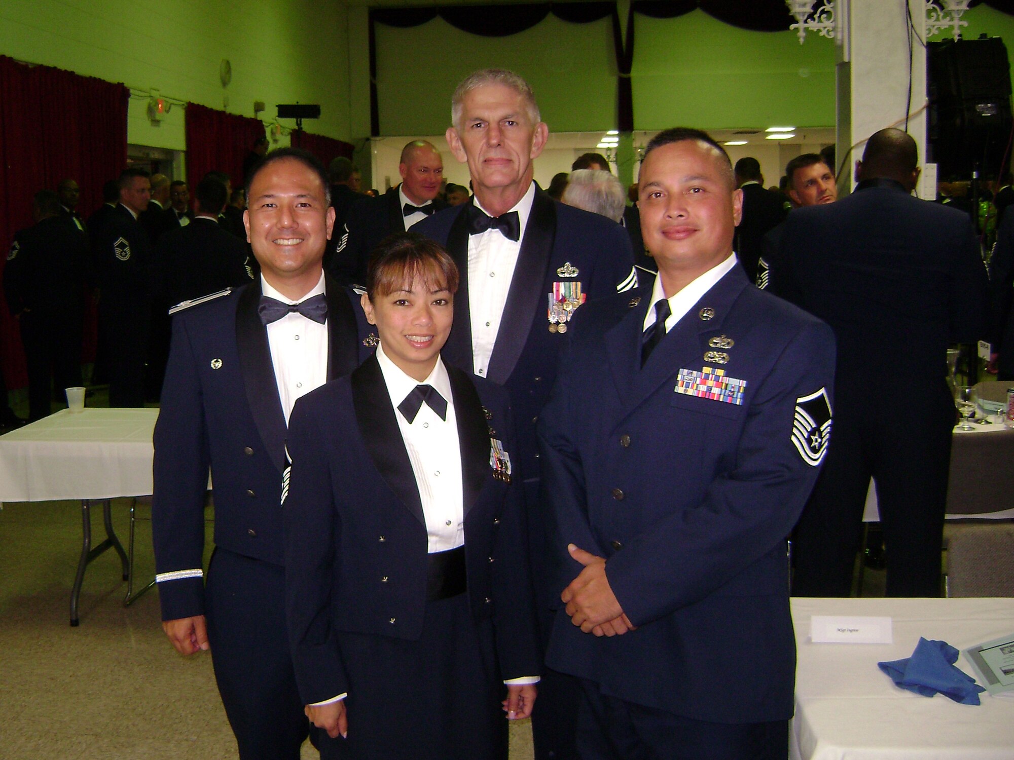 Lt. Col. Randall Honke, 624th Regional Support Group, and Chief Master Sgt. Daniel Cogar, 624th RSG, congratulate Master Sgt. Chris Aragon-Lim and Master Sgt. Joey Manibusan of the 624th RSG on their graduation from Senior Non-commissioned Officer Academy September 16, 2008 at Gunter Annex, Ala.  Master Sgt. Aragon-Lim, a member of the 48th Aerial Port Squadron based at Hickam Air Force Base, Hawaii, and Master Sgt. Manibusan, a member of the 44th APS based at Andersen AFB, Guam,  attended the enlisted leadership school for almost seven weeks.  