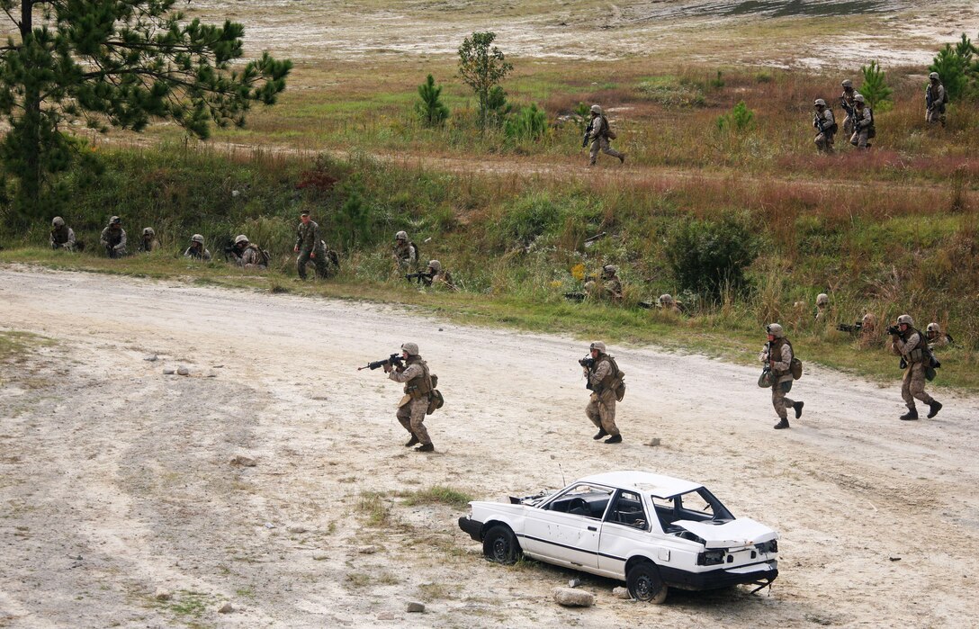 Marines from Lima Company, Battalion Landing Team, 3rd Battalion, 2nd Marine Regiment, 22nd Marine Expeditionary Unit, assault a mock town aboard Camp Lejeune, N.C., during a helicopter-raid training course Oct. 17, 2008. The Marines attended the course to train on the proper techniques for performing a raid. The 22nd MEU is scheduled for a six-month deployment early next year. (Official Marine Corps Photo by Cpl. Theodore W. Ritchie)::r::::n::