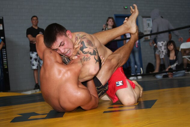 Brian Perez, a middleweight competitor in Fight Club 29, applies a geoteen choke to an opponent at the Grapplers Extreme Tournament at the Army National Guard 40th Infantry Brigade armory Oct. 18, 2008.