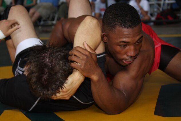 David Dew, lightweight fighter in the Combat Center’s Fight Club 29, works to get a side choke on an opponent during the Grapplers Extreme Tournament at the Army National Guard 40th Infantry Brigade armory Oct. 18, 2008.