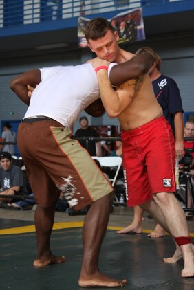 Fighter Tyler Mouge goes head-to-head with an opponent during the Grapplers Extreme Tournament at the Army National Guard 40th Infantry Brigade armory Oct. 18, 2008.
