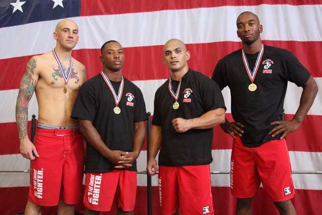 Fight Club 29 members Jay Demetrulius, David Dew, James Clark and Dominique Waters pose with their medals after completing the Grapplers Extreme Tournament, the final grappling tournament the team will participate in this quarter, at the Army National Guard 40th Infantry Brigade armory Oct. 18, 2008.
