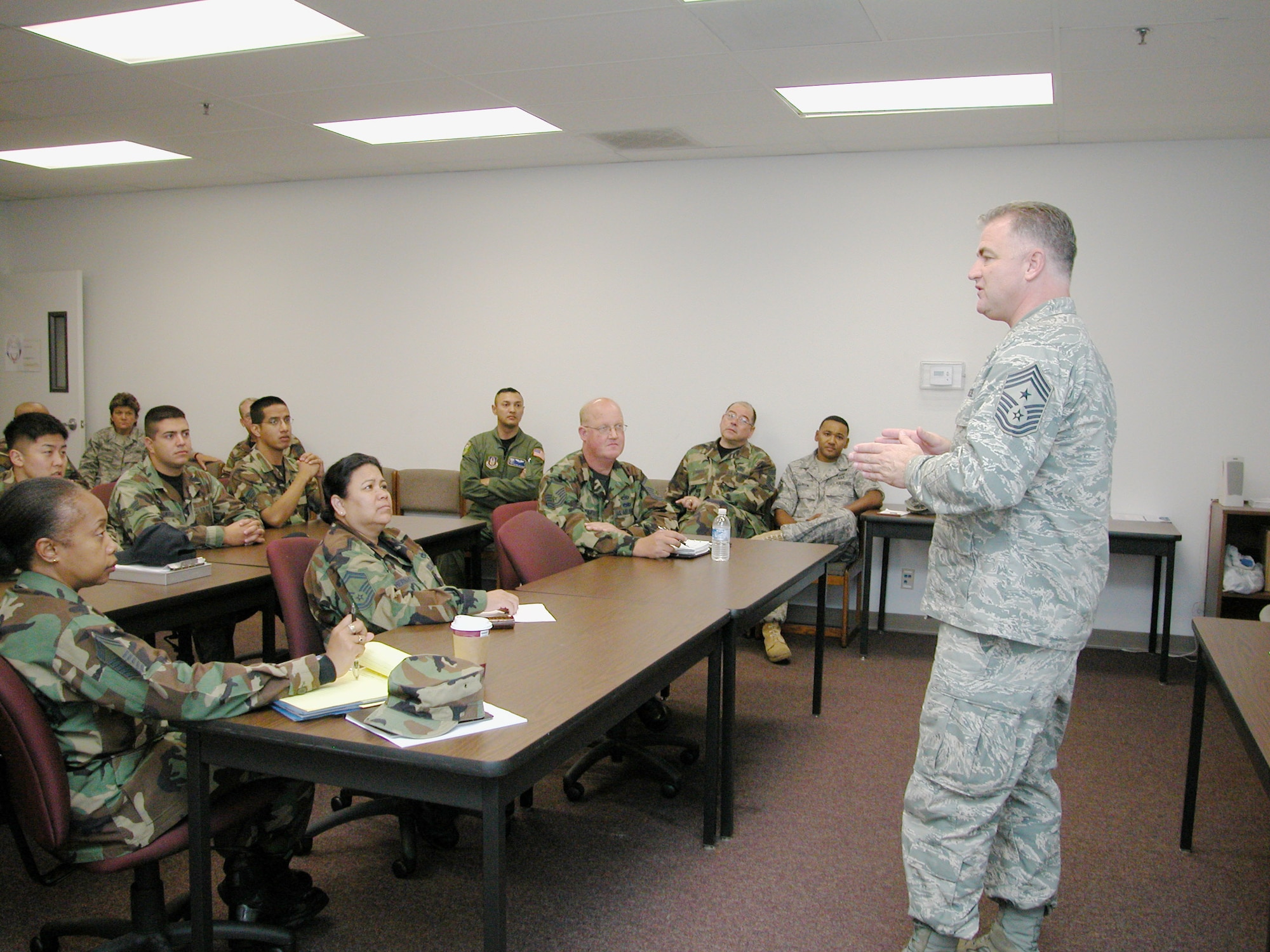 Air Force Reserve Command’s highest-ranking enlisted member, Chief Master Sgt. Troy McIntosh, speaks to a Rising Six meeting at the Education and Training Center, Sunday, during his March ARB visit. During the visit, he signed a mock-up of the new Rising Six logo. The chief said he was impressed by what he saw here and heard about what the Rising Six and the Top 3 were doing to keep communication lines open between leaders and junior enlisted members . An enlisted call was held in the Cultural Center where the Chief discussed a couple of the new priorities: partnering with the joint and coalition teams to win today’s fight, and developing and caring for Airmen and their families. Chief McIntosh also discussed the Air Force Reserve’s greatest claim to fame, balancing family and service to country, and he encouraged everyone to take charge of their own careers. (U.S. Air Force photo by Staff. Sgt. Joe Davidson)