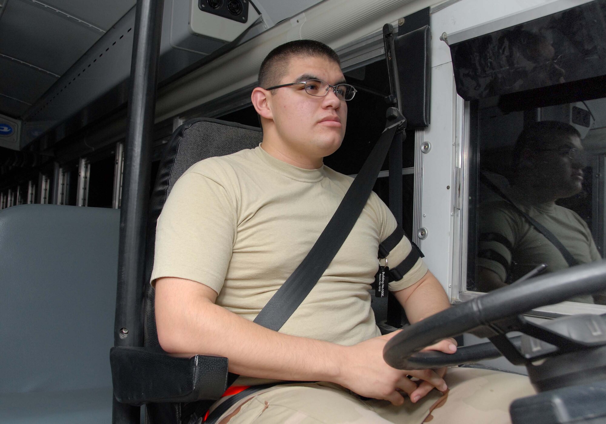 SOUTHWEST ASIA -- Airman 1st Class Stephen Lucero spends part of the long desert night waiting to provide transportation to about 25 E-3 Sentry air crew members here Oct. 7. Airman Lucero, deployed from Yakota AB, Japan, is a vehicle operator with the 380th Expeditionary Logistics Readiness Squadron. (U.S. Air Force photo by Tech. Sgt. Denise Johnson) (released)