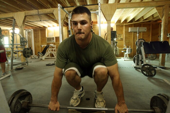 Cpl. Arron M. Stephens, 27, a former personal trainer, spends his free time lifting weights in the gym and helping other Marines with their exercise programs and nutrition.  Stephens, an administrative clerk for Headquarters and Service Company, Task Force 3rd Battalion, 7th Marine Regiment, Regimental Combat Team 5, has been using the knowledge he gained to become a certified personal trainer to help Marines get themselves in shape during the battalion's deployment to Iraq.::r::::n::