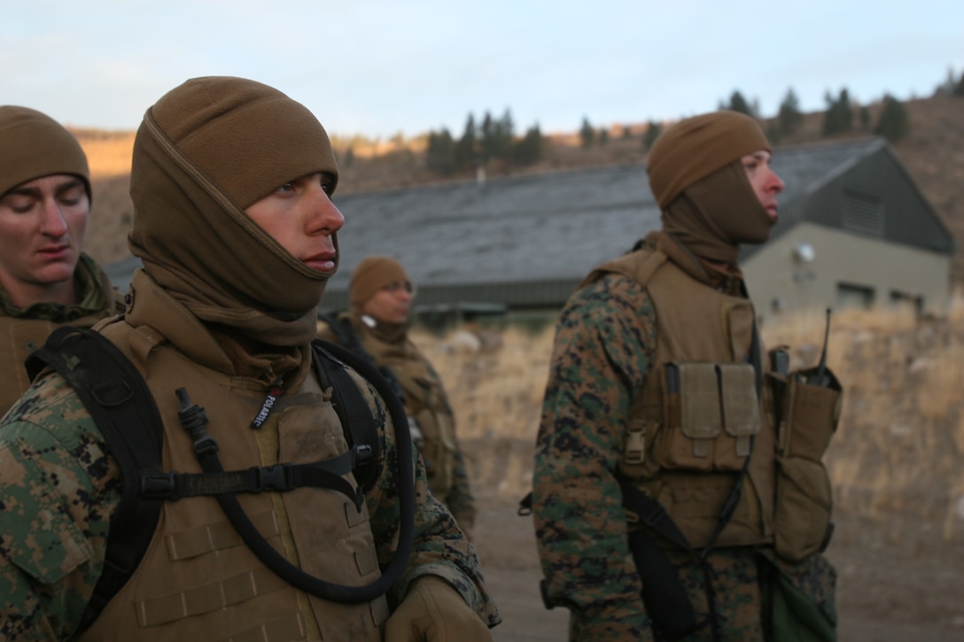 Marines with 3rd Batallion, 9th Marine Regiment Prepare to be trucked to Landing Zone Woody, from which they will hike to Landing Zone Cardinal to engage in survival classes and field operations. The Marines were in the field four days during this operation, living in expedient shelters and learning what to expect when deployed.