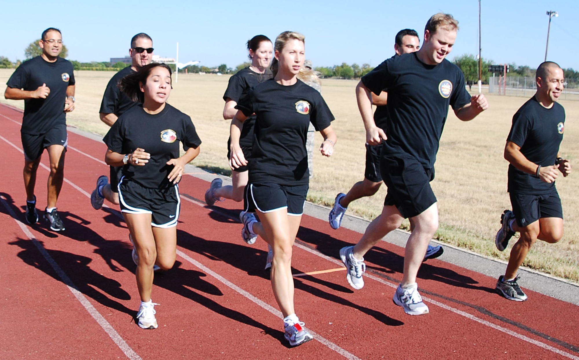Members from the 433rd Air Medical Staging Squadron keep each other motivated as they train in preperation for the 2008 Inagural San Antonio Rock 'n' Roll Marathon.