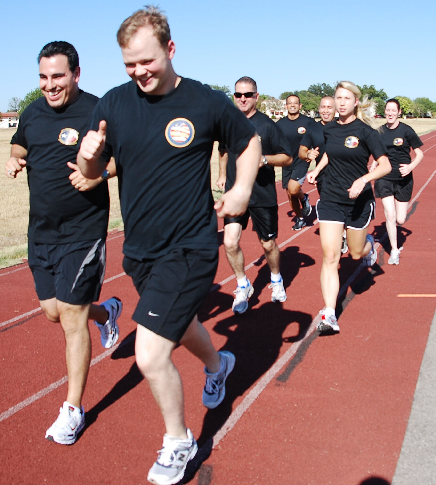 Members from the 433rd Air Medical Staging Squadron keep each other motivated as they train in preperation for the 2008 Inagural San Antonio Rock 'n' Roll Marathon.