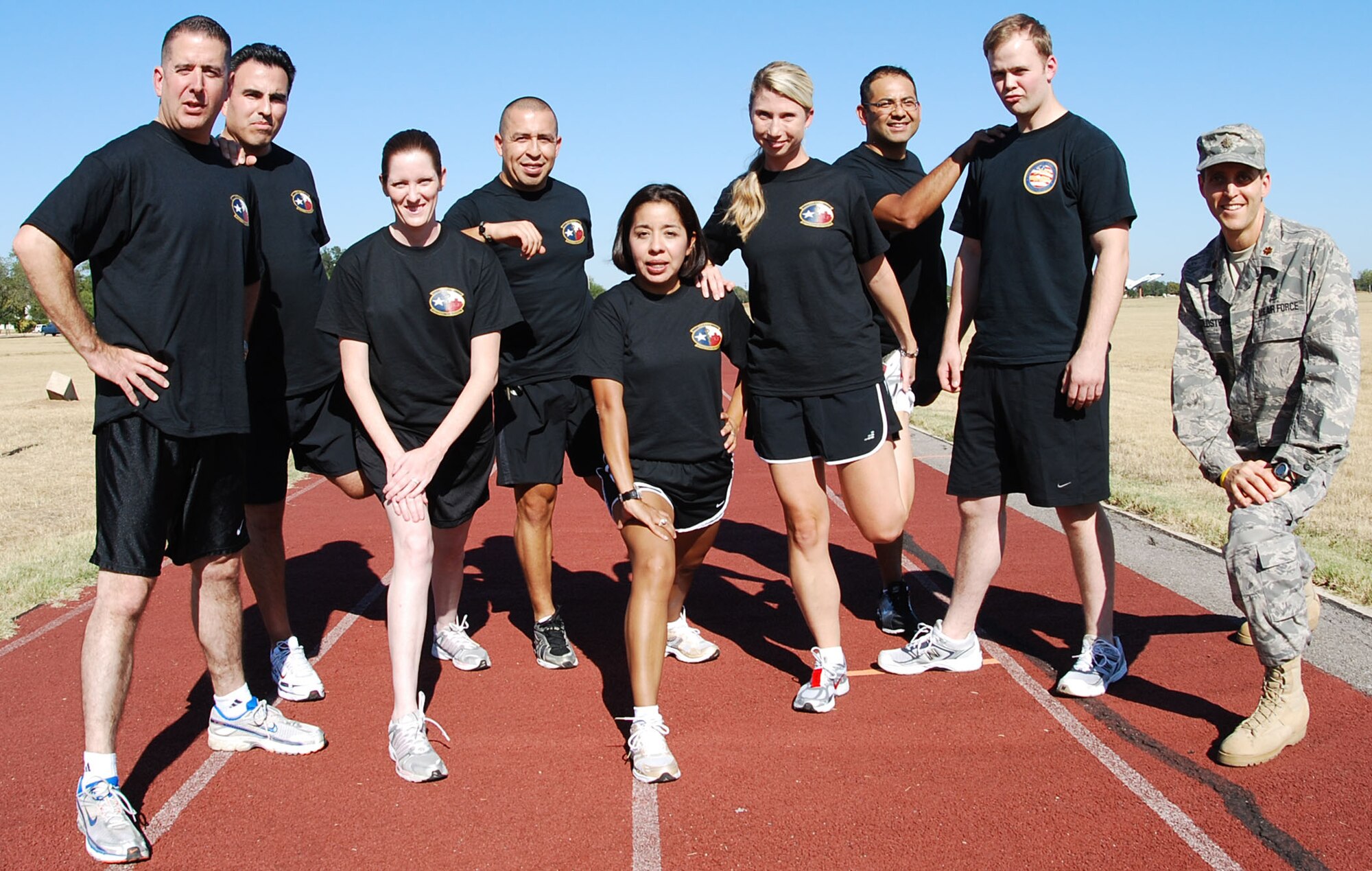 Members from the 433rd Air Medical Staging Squadron keep each other motivated as they train in preperation for the 2008 Inagural San Antonio Rock 'n' Roll Marathon.