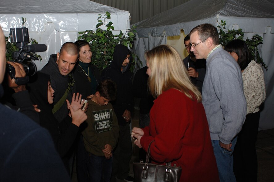Col John J. Jordan (right), 501st Combat Support Wing Vice Commander , and Chief Master Sgt. Maria D. Vaughn, 501 CSW Command Chief, meet Scott Stapp, his family, and friends prior to the band's performance at RAF Molesworth Oct 15. Hundreds of service members, DOD civilians, Ministry of Defense employees and family members came out to get a taste of home from Scott Stapp and his band who are on tour to entertain service members around the world. Stapp praised the men and women of the armed forces and their families for the daily sacrifices they make.