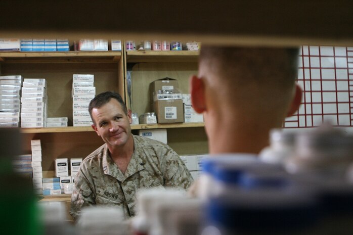 Navy Lt. Malcolm Brown, the Battalion surgeon with Task Force 2nd Battalion, 2nd Marine Regiment, Regimental Combat Team 5, interviews a sailor about his Post Deployment Health Assessment (PDHA) answers at Rawah, Iraq, Oct. 19. "(PDHAs) are an important tool," Brown said. ::r::::n::'We always find at least one potentially serious situation that has not been addressed or followed up on."