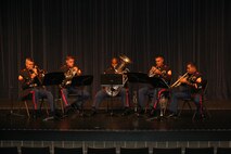 Members of the Brass Quintet from the Marine Corps Air Ground Combat Center Twentynine Palms, Calif., perform at Orchard View High School, Muskegon, Mich. Oct. 20, 2008. The Quintet went on a five-day tour of Recruiting Station Lansing Oct. 20-24, performing for the public and offering clinics for the students.