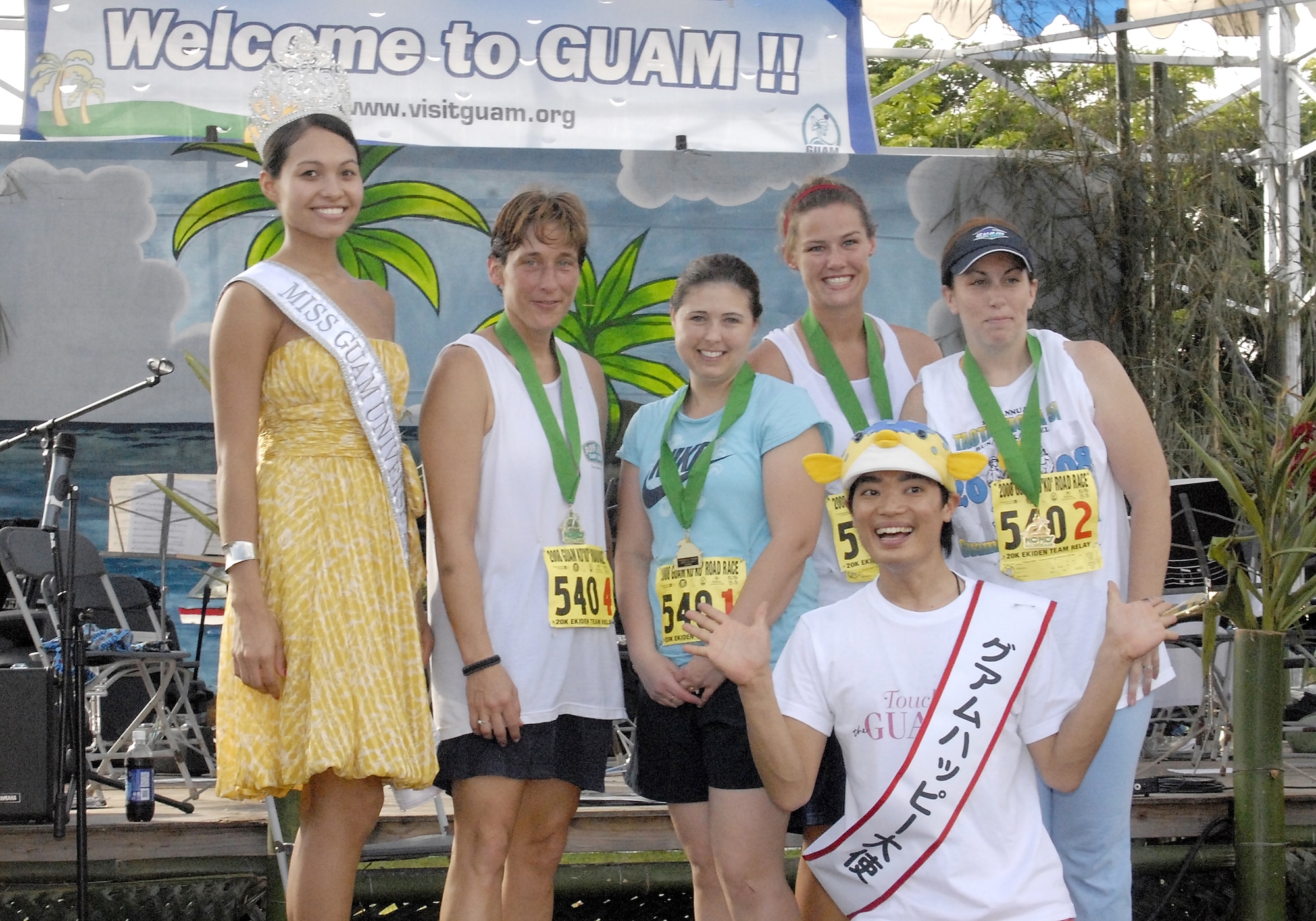 ANDERSEN AIR FORCE BASE, Guam-- Maria Luisa Santos, Miss Guam Universe 2008 presents awards to 36th Medical Group Master 1st place female Ekiden relay team winners, Master Sgt. Theresa Szwerluga, Senior Airman Sandy Cornwell, Staff Sgt. Rayanne Shonk and Tech. Sgt. Trina Hjelseth during the Guam Ko'ko' Road Race Oct. 19. (U.S. Air Force photo by Master Sgt. Lisa M. Zunzanyika)