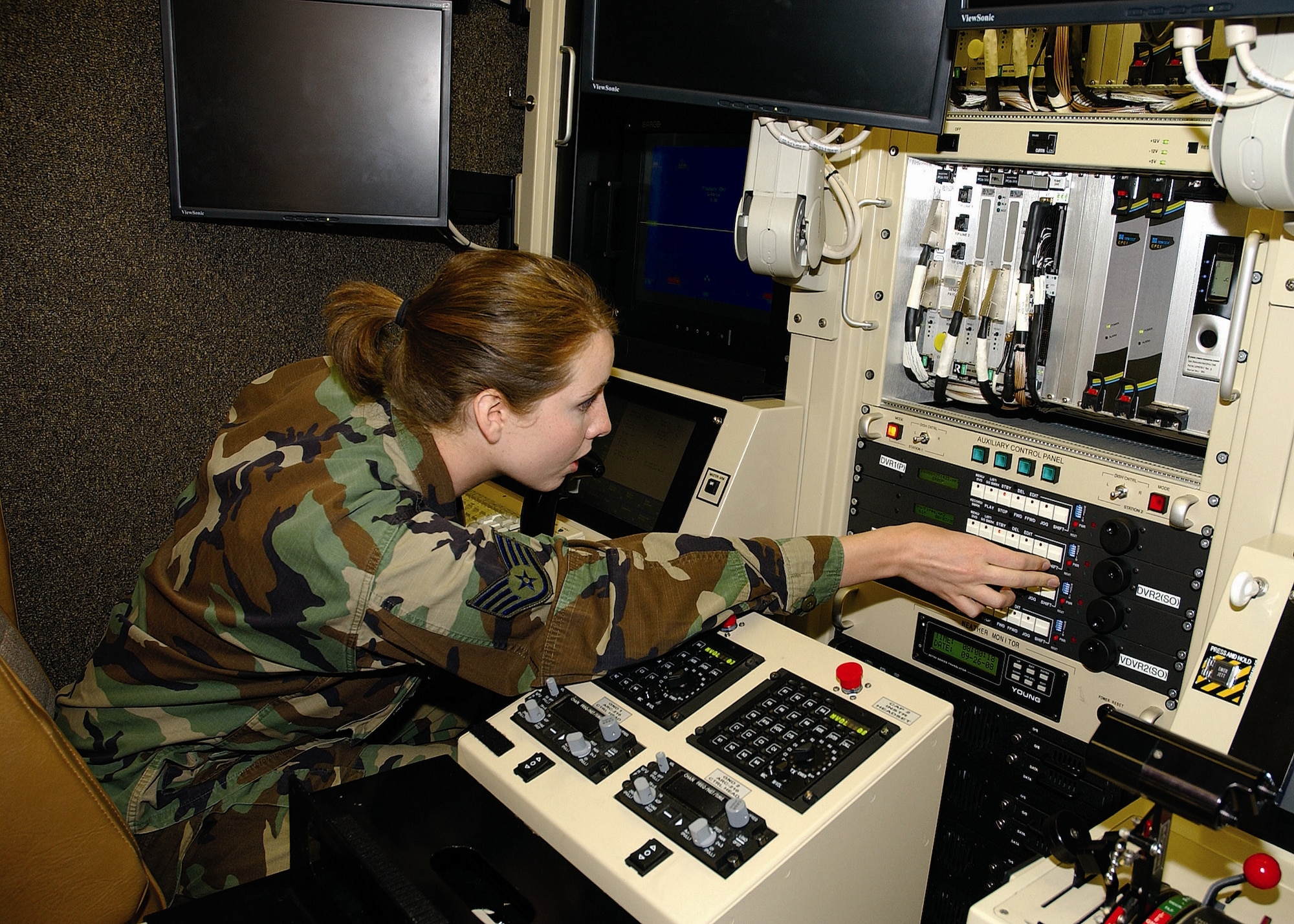 Staff Sgt. Carolyn Smette, a Ground Control Station maintenance technician assigned to the North Dakota Air National Guard’s 119th Wing, troubleshoots some of the GCS’ systems. (U.S. Air Force photo by Capt. Al Bosco)