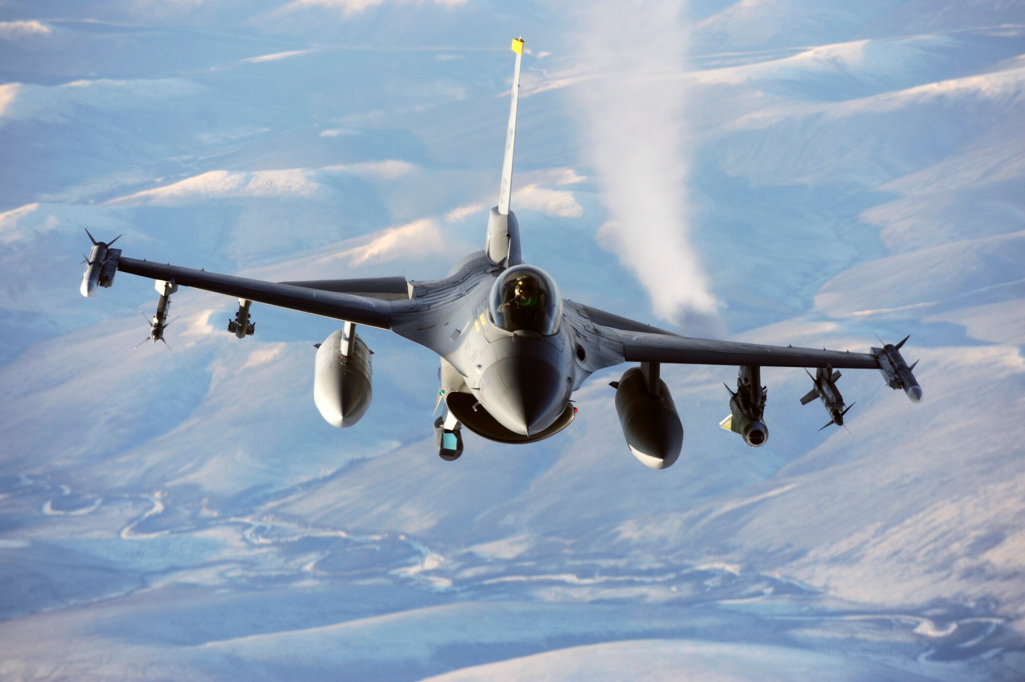 A F-16 Fighting Falcon flies over the Pacific Alaskan Range Complex during RED FLAG-Alaska 09-1 Oct. 16, 2008, at Eielson Air Force Base, Alaska. The PARC provides 67,000 square miles of airspace, one conventional bombing range and two tactical bombing ranges containing more than 400 different types of targets and more than 30 threat simulators, both manned and unmanned. The F-16 is assigned to the 80th Fighter Squadron, Kunsan Air Base, Korea.  (U.S. Air Force photo/Senior Airman Jonathan Snyder)