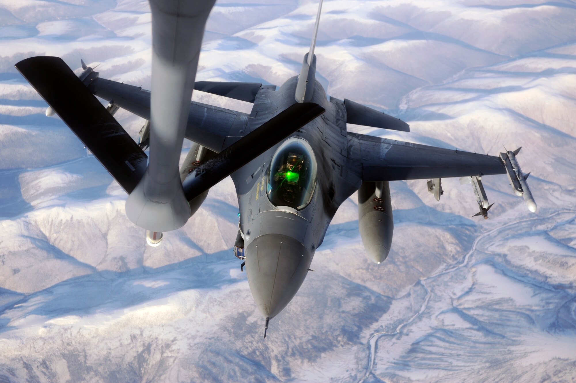 A F-16 Fighting Falcon sits in pre-contact position behind a KC-135 Stratotanker during RED FLAG-Alaska 09-1 Oct. 16, 2008, at Eielson Air Force Base, Alaska. The Pacific Alaskan Range Complex provides 67,000 square miles of airspace, one conventional bombing range and two tactical bombing ranges containing more than 400 different types of targets and more than 30 threat simulators, both manned and unmanned. The F-16 is assigned to the 80th Fighter Squadron, Kunsan Air Base, Korea. The KC-135 is assigned to the 384th Air Refueling Squadron, McConnell Air Force Base, Kan.  (U.S. Air Force photo/Senior Airman Jonathan Snyder)