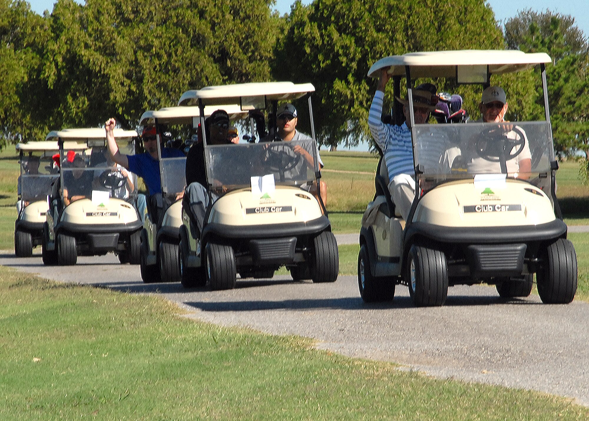 Tournament participants head to their assigned hole to start the Wind Creek Golf Course 50th Anniversary Tournament Oct. 17. Thirty-eight teams participated in the four man scramble. (U.S. Air Force photo/Lou Anne Sledge)