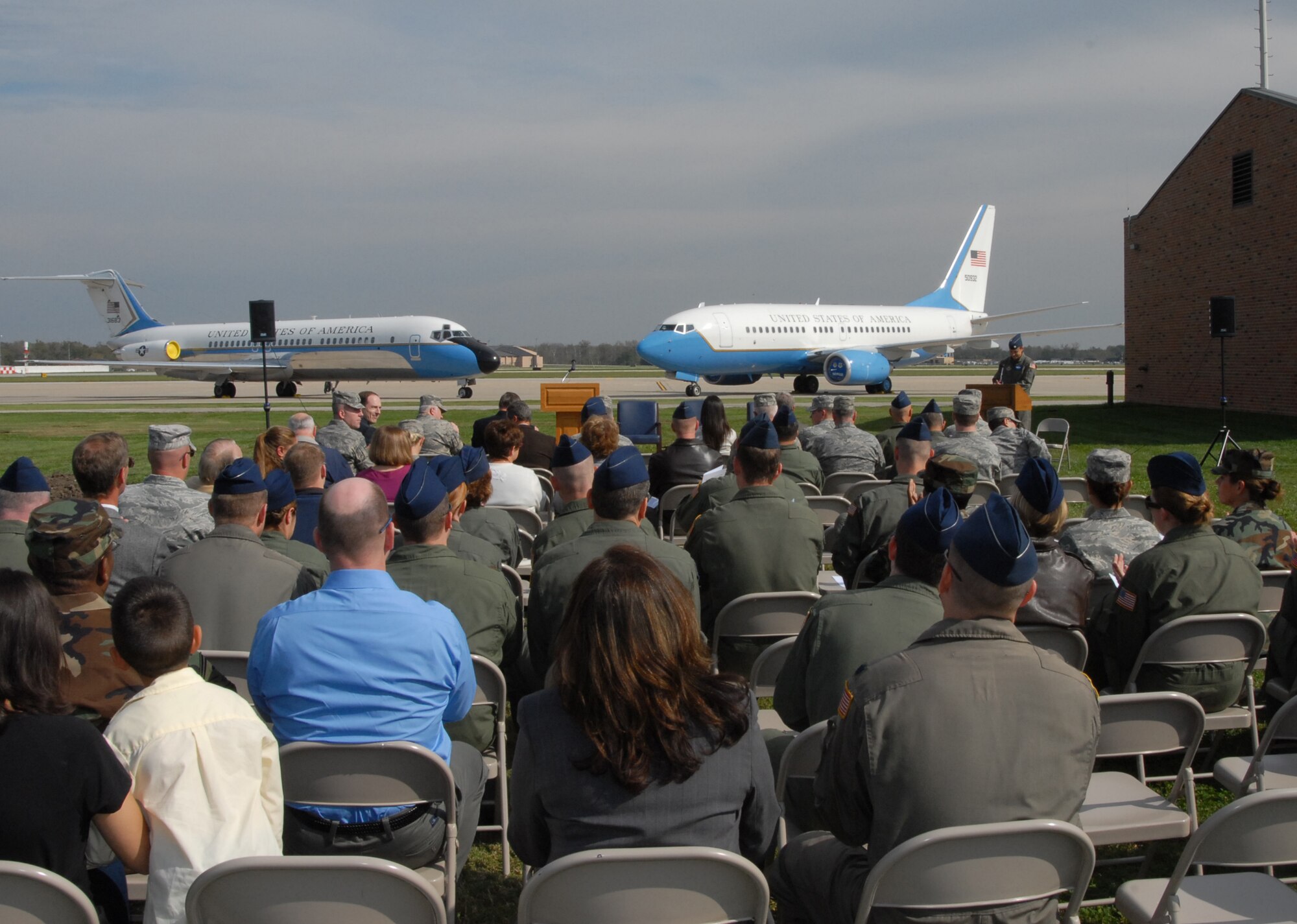 A 932nd Airlift Wing C-9C (left) and C-40C (right) face center stage for the start of a ground breaking event at Scott Air Force Base.  The shovels turned new dirt during the initial ground breaking of the Air Force Reserve’s newest Operations Group facility and the combined 375th Airlift Wing / 932d Airlift Wing Command Post and Installation Control Center. U.S. Air Force photo/Tech. Sgt. Gerald Sonnenberg