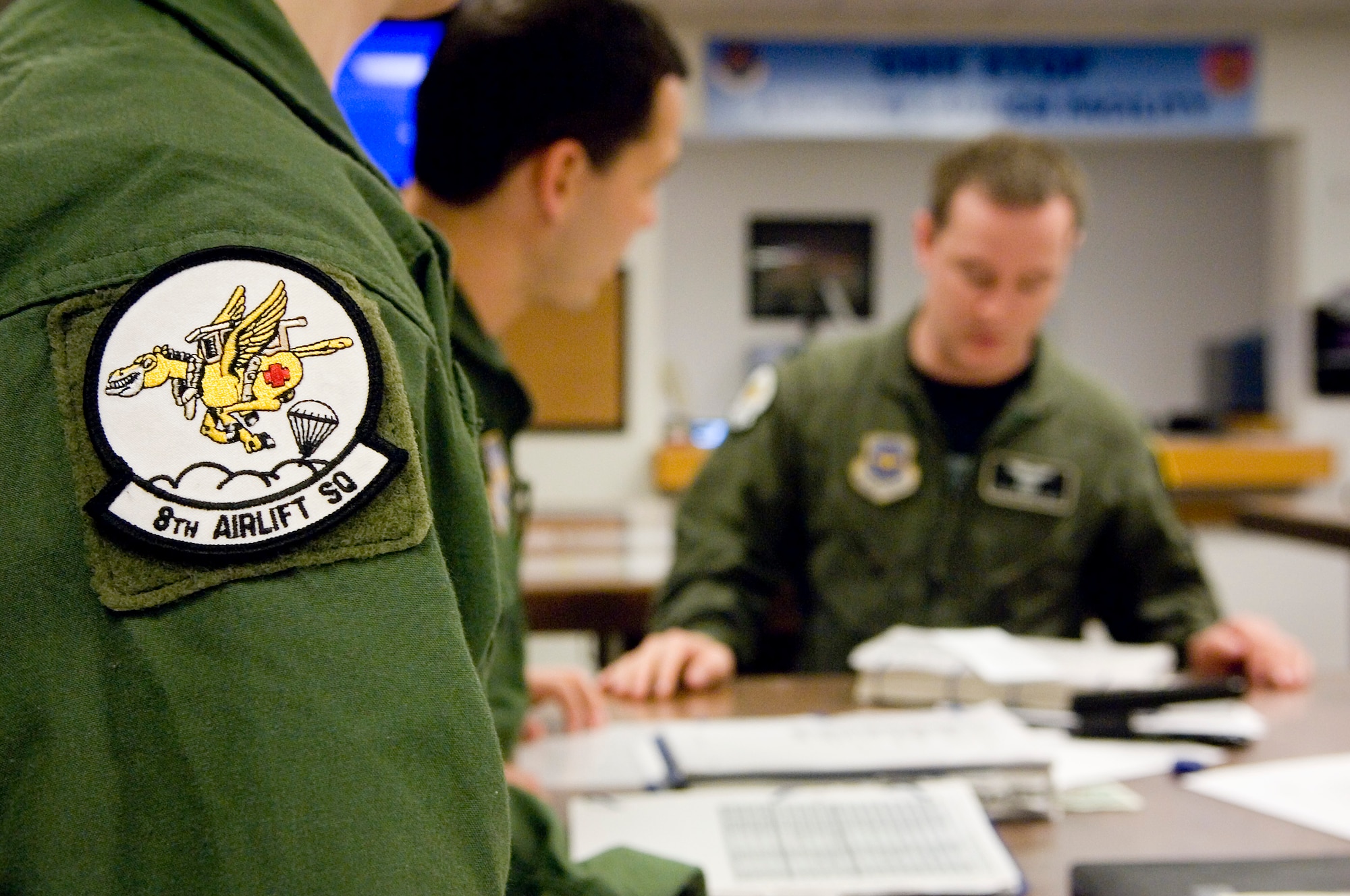 8th AS pilots complete preflight planning before a training mission at the squadron’s one-stop launch facility. (U.S. Air Force photo/Abner Guzman)