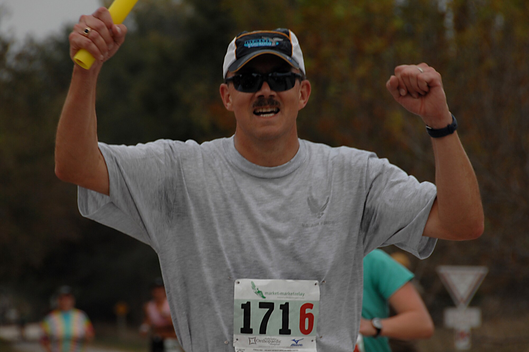 Lt. Col. Brad Hyndman, 610th Intelligence Flight commander, was in good spirits from dusk to dawn Oct. 11, while participating in the Market to Market Relay Race from downtown Omaha to downtown Lincoln Nebraska. This was the first long distance race of its kind in Nebraska and the Air Force Reserve team was one of the 150 teams to participate in the race which covered 86 miles. (U.S. Air Force Photo Courtesy of 55th Wing Public Affairs)