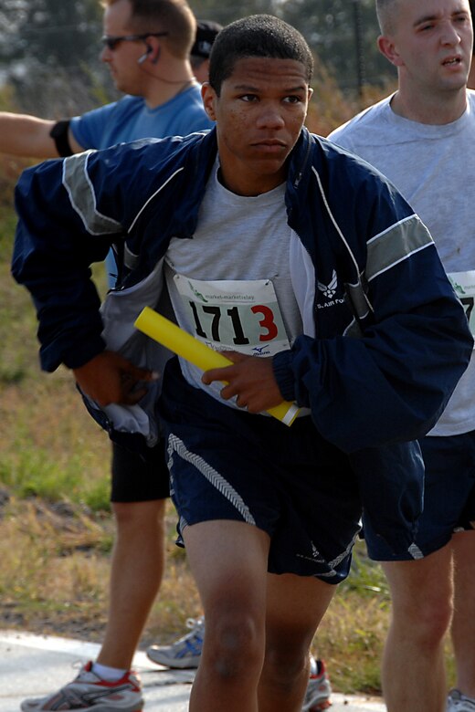 Senior Airman Chris Patton, supply management technician with the Air Force Reserve’s 610th Intelligence Flight, takes off with baton in hand Oct. 11 at the Market to Market Relay Race. It was the first long distance race of its kind in Nebraska stretching 86 miles from the Old Market in Omaha to the Hay Market in Lincoln. There were 150 teams with six to eight runners on each team. (U.S. Air Force Photo Courtesy of 55th Wing Public Affairs)