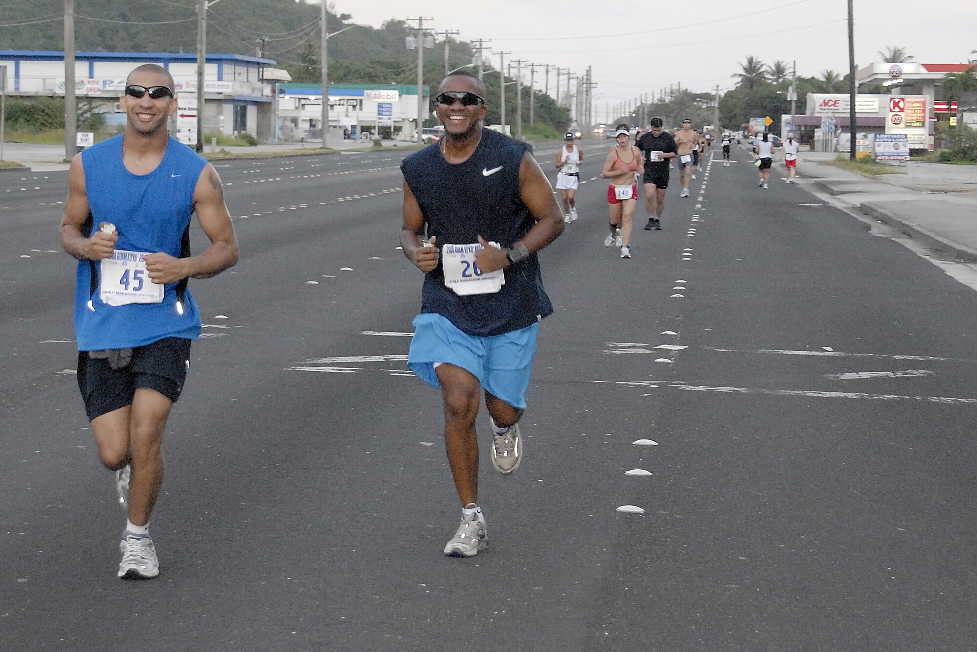 ANDERSEN AIR FORCE BASE, Guam-- Staff Sgt. David White and Master Sgt. Don Gambles of the 36th Mobility Response Squadron challenge themselves during the half-marathon portion of the Guam Ko'ko' Road Race Oct. 19. (U.S. Air Force photo by Master Sgt. Lisa M. Zunzanyika)