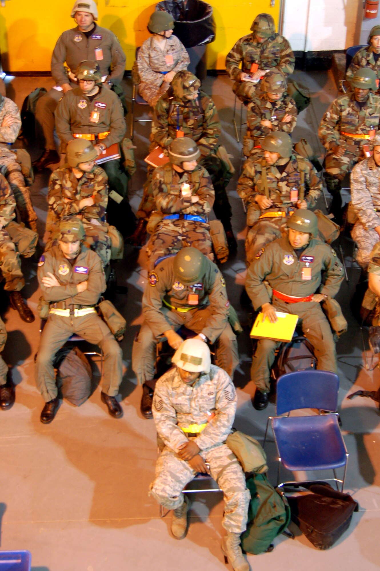Airmen wait for outprocessing at the Edwards Mobility Processing Center Oct. 20. during a Phase I exercise in preparation for a Unit Compliance Inspection in January. (Air Force photo by Senior Airman Julius Delos Reyes)