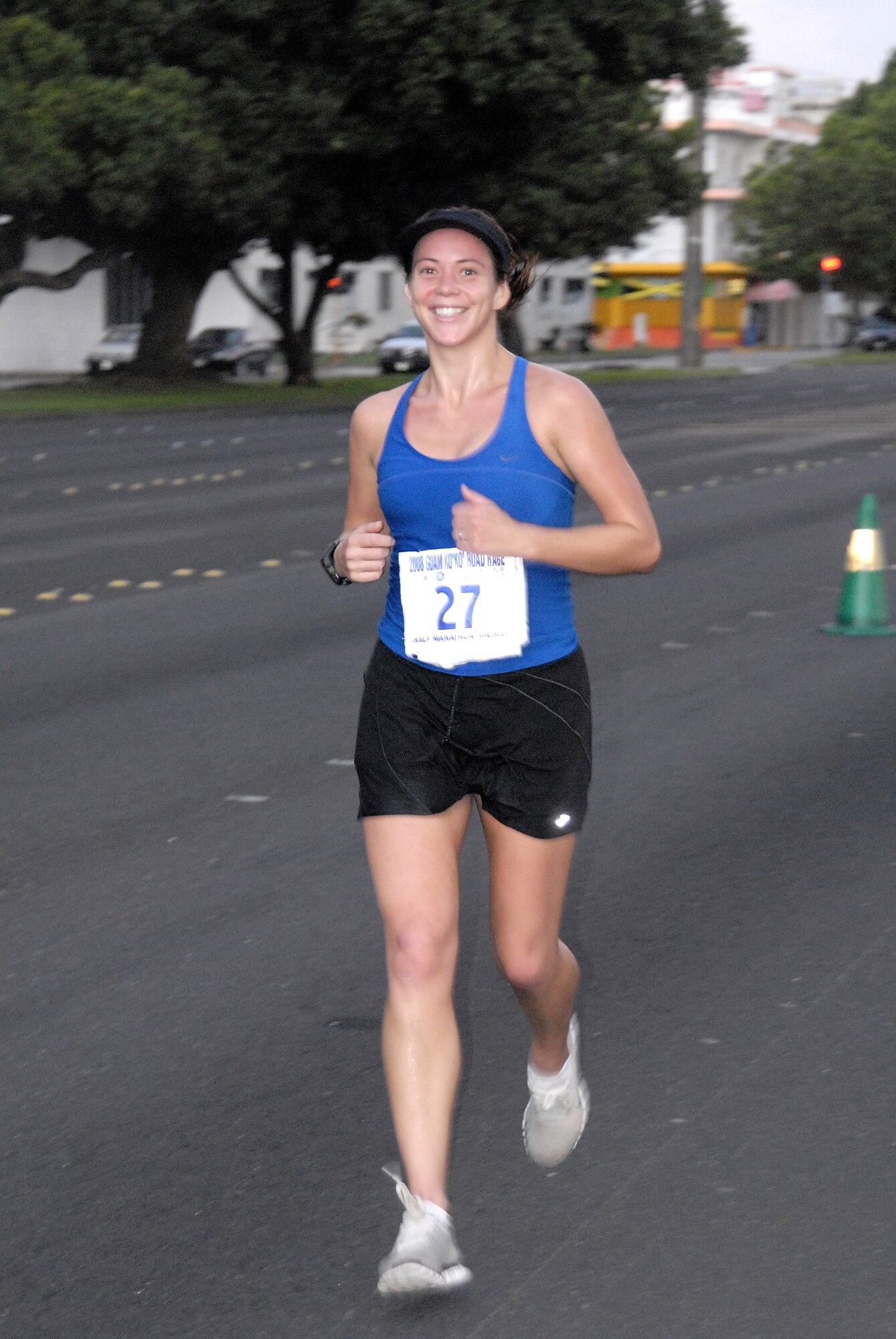 ANDERSEN AIR FORCE BASE, Guam-- Emilie Fidler, wife of Tech. Sgt. Danny Fiddler of the 36th Contingency Response Group, takes it all in stride during the Guam Ko'ko' Road Race Oct 19. Emilie finished 1st place in the submaster female (30-39 yrs.) division of the half marathon.  (U.S. Air Force photo by Master Sgt. Lisa M. Zunzanyika)