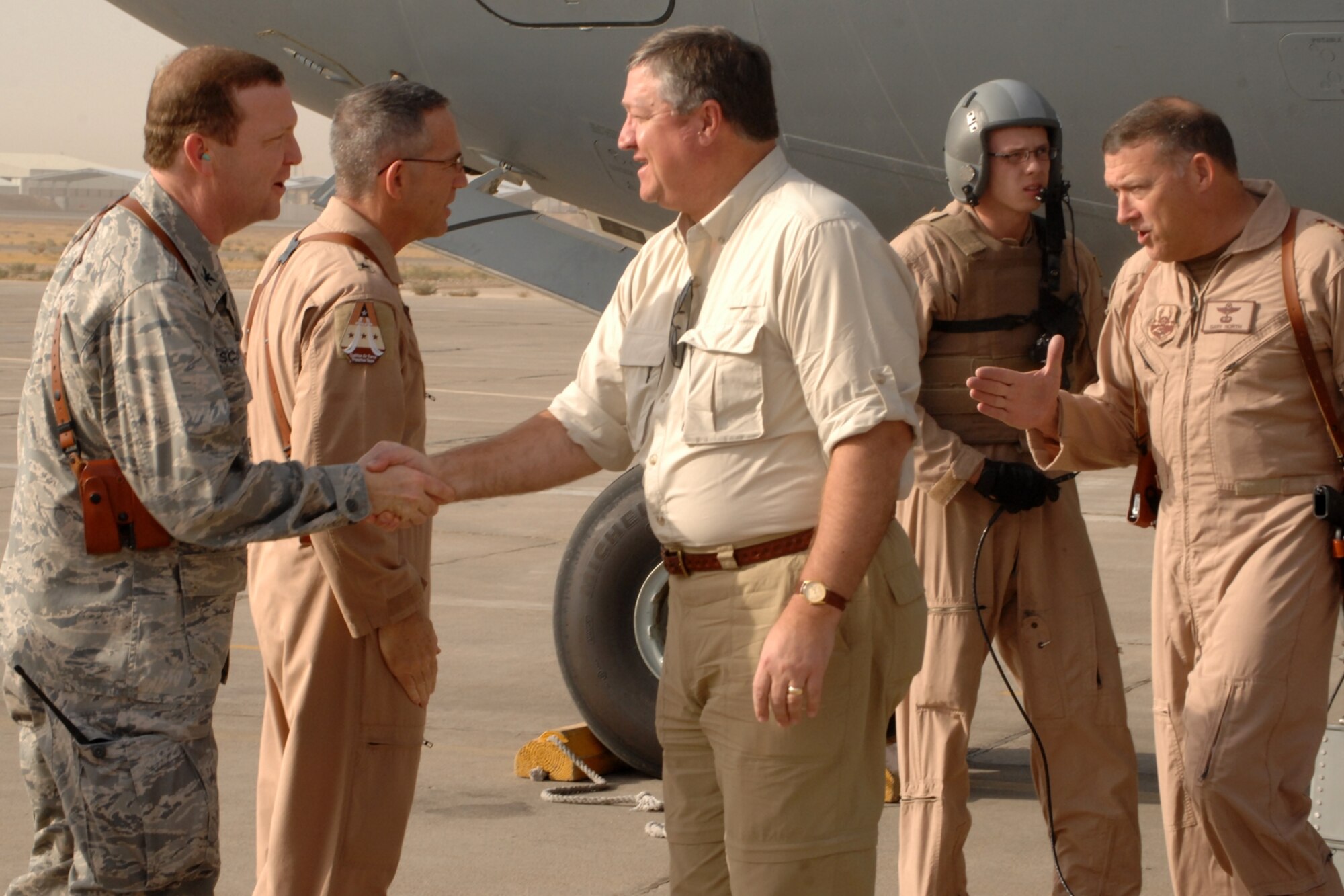KIRKUK REGIONAL AIR BASE, Iraq -- Colonel Richard Scobee, 506th Air Expeditionary Group commander, greets Secretary of the Air Force Michael Donley during his visit here Oct. 14. The secretary toured various facilities and spoke to Airmen about his vision for the overall mission within the Southwest Asia AOR and the future of the Air Force. Colonel Scobee is the 944th Fighter Wing commander deployed from Luke Air Force Base, Ariz. (U.S. Air Force photo/Senior Airman Randi Flaugh) 