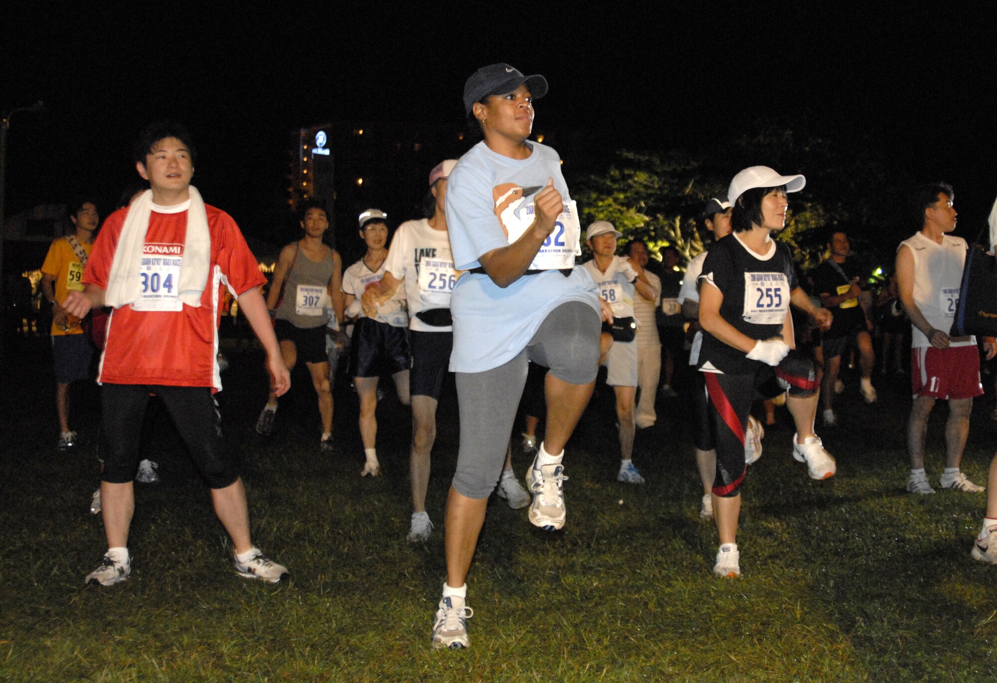 ANDERSEN AIR FORCE BASE, Guam-- Master Sgt. Hazel Wong of the 36th Medical Group participates in warm-up exercises prior to the start of the Guam Ko'ko' Road Race Oct. 19. Sergeant Wong was one of several Team Andersen personnel to have completed their first half marathon.  (U.S. Air Force photo by Master Sgt. Lisa M. Zunzanyika)