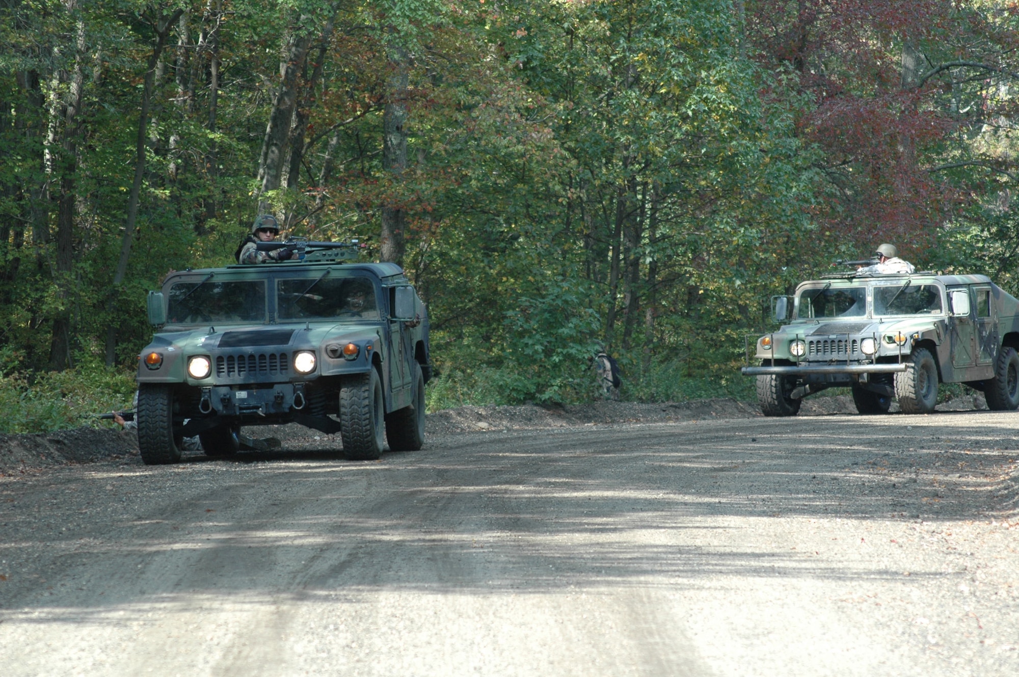 Students in the Advanced Contingency Skills Training Course 09-1 react to a scenario during convoy operations training on a Fort Dix, N.J., range Oct. 9, 2008.  ACST is taught by the U.S. Air Force Expeditionary Center's 421st Combat Training Squadron and prepares Airmen for upcoming deployments.  (U.S. Air Force Photo/Staff Sgt. Paul R. Evans)
