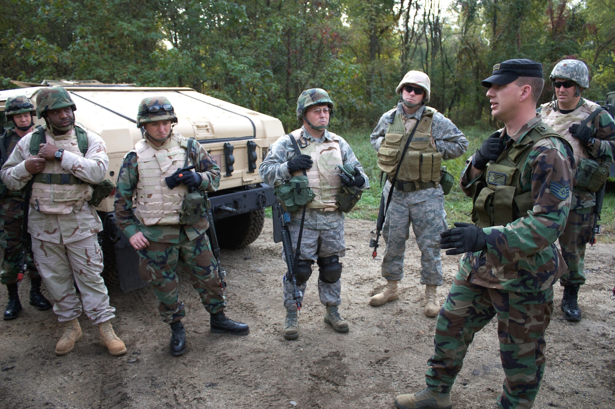 Staff Sgt. Paul Evans (right), contingency skills training instructor with the 421st Combat Training Squadron, briefs students in the Advanced Contingency Skills Training Course on field tactics Oct. 9, 2008, during training on a Fort Dix, N.J., range.  ACST is taught by the U.S. Air Force Expeditionary Center's 421st CTS and prepares Airmen for upcoming deployments.  (U.S. Air Force Photo/Tech. Sgt. Lionel Castellano)