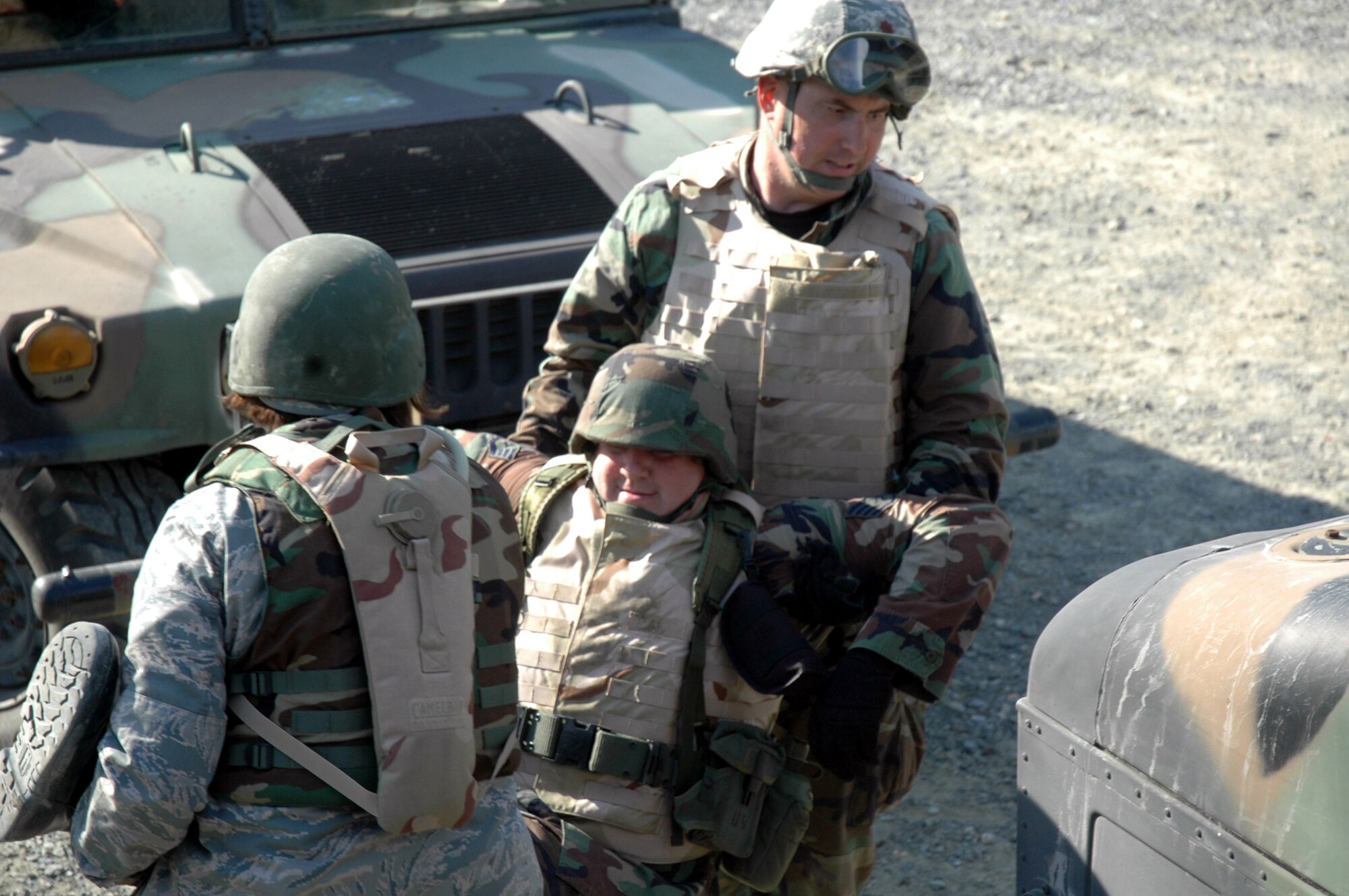 Students in the Advanced Contingency Skills Training Course 09-1 practice moving a victim from a high-mobility, multi-wheeled vehicle, or HMMWV, during training on a Fort Dix, N.J., range Oct. 8, 2008.  ACST is taught by the U.S. Air Force Expeditionary Center's 421st Combat Training Squadron and prepares Airmen for upcoming deployments.  (U.S. Air Force Photo/Staff Sgt. Paul R. Evans)