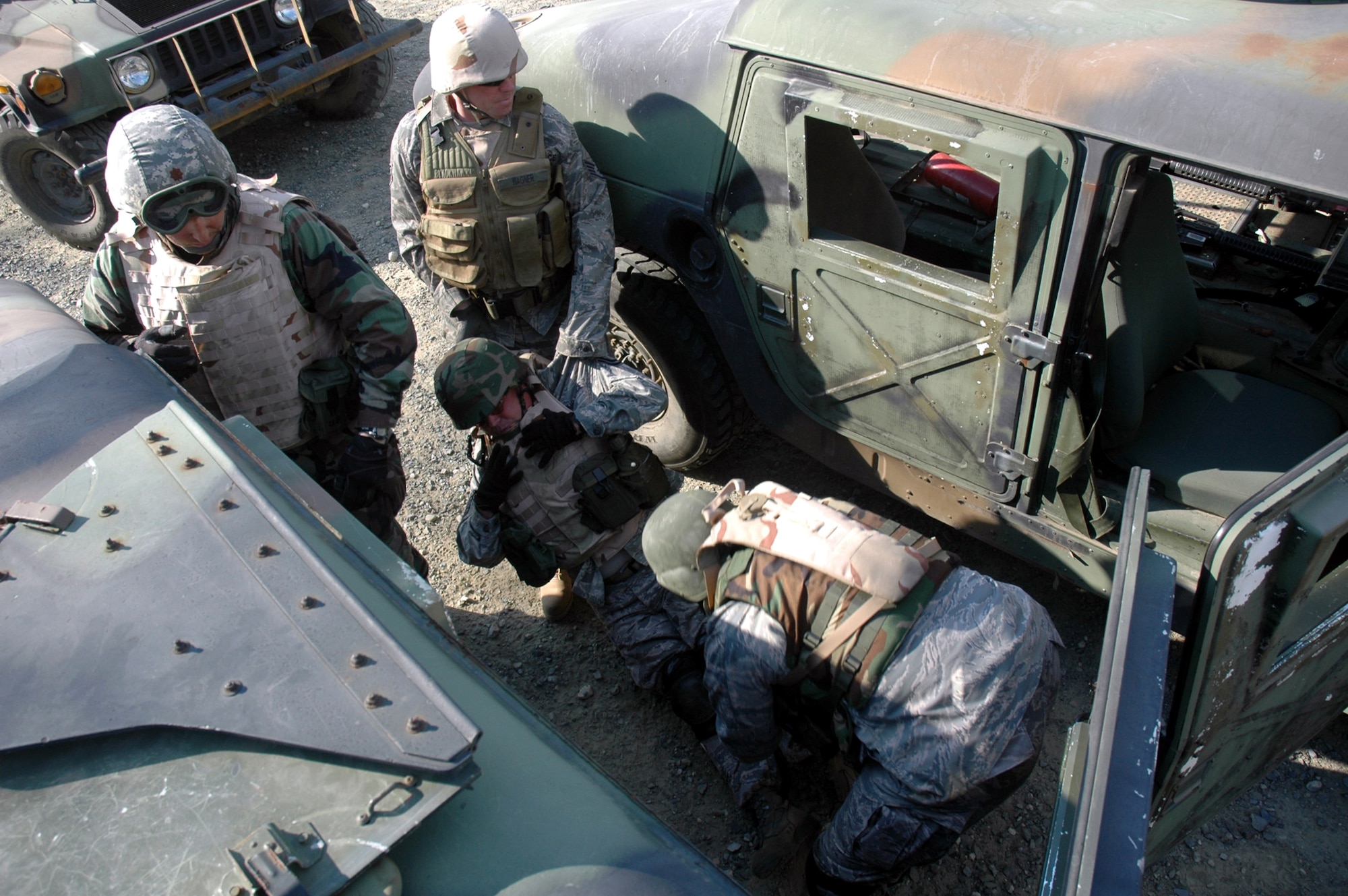 Students in the Advanced Contingency Skills Training Course 09-1 practice moving a victim from a high-mobility, multi-wheeled vehicle, or HMMWV, during training on a Fort Dix, N.J., range Oct. 8, 2008.  ACST is taught by the U.S. Air Force Expeditionary Center's 421st Combat Training Squadron and prepares Airmen for upcoming deployments.  (U.S. Air Force Photo/Staff Sgt. Paul R. Evans)