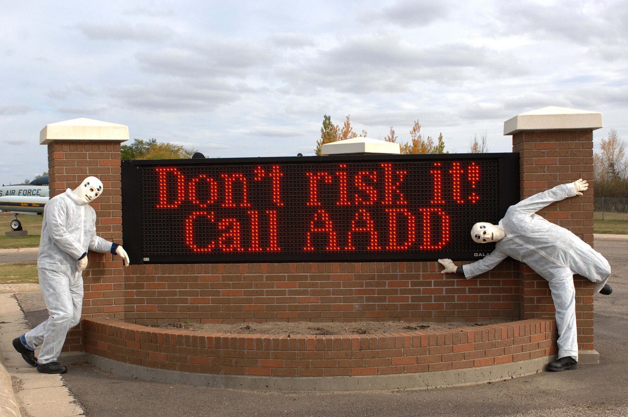 MINOT AIR FORCE BASE, N.D. – Tech. Sgt. Erica Robinson, 5th Bomb Wing, and her husband, Staff Sgt. Jonathan Robinson, 5th Logistics Readiness Squadron, pose in front of the base marquee while dressed in crash test dummy costumes here Oct. 10 as part of their effort to promote safe driving. The Robinson’s, both active in the Airmen Against Drunk Driving program, were also reminding base personnel to call AADD if their original plan falls through. (U.S. Air Force photo by Senior Airman Kelly Timney)