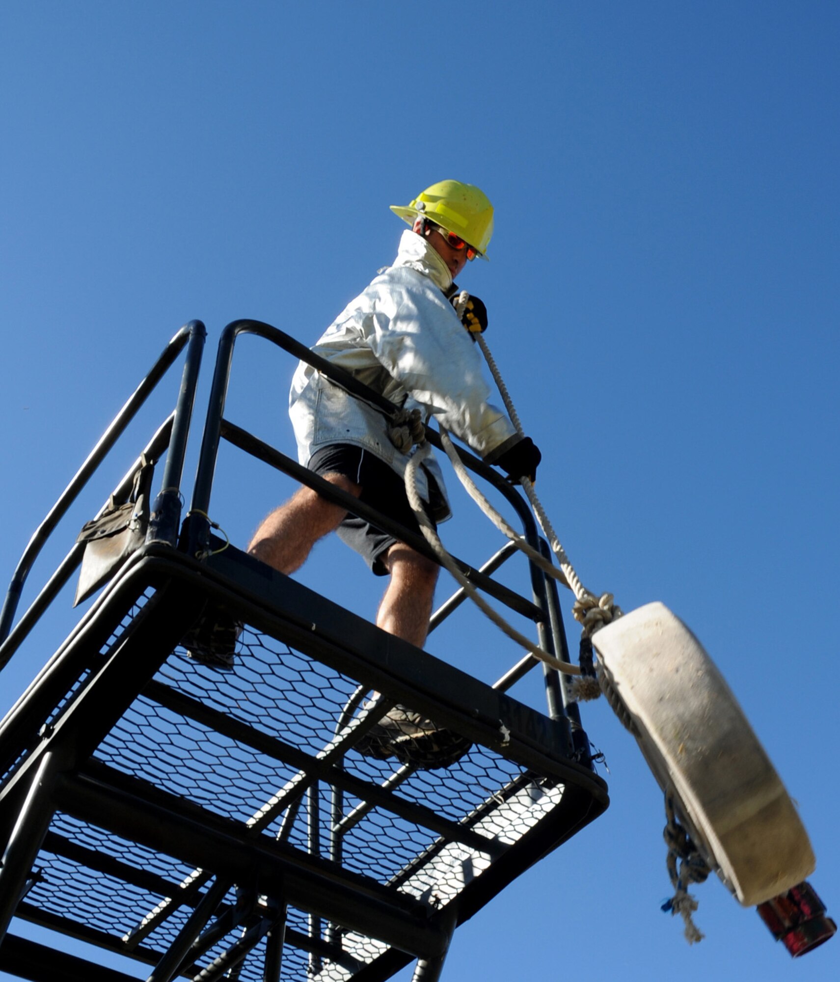 CANNON AIR FORCE BASE, N.M. -- 2nd Lt. LesLee Roderick, 27th Special Operations Civil Engineer Squadron, pulls a fire hose during the obstacle challenge at the annual Fire Prevention Week Fire Muster. The muster concluded fire prevention week, which focused on fire prevention measures that should be taken throughout the year. (U.S. Air Force photo by Airman 1st Class Evelyn Chavez)