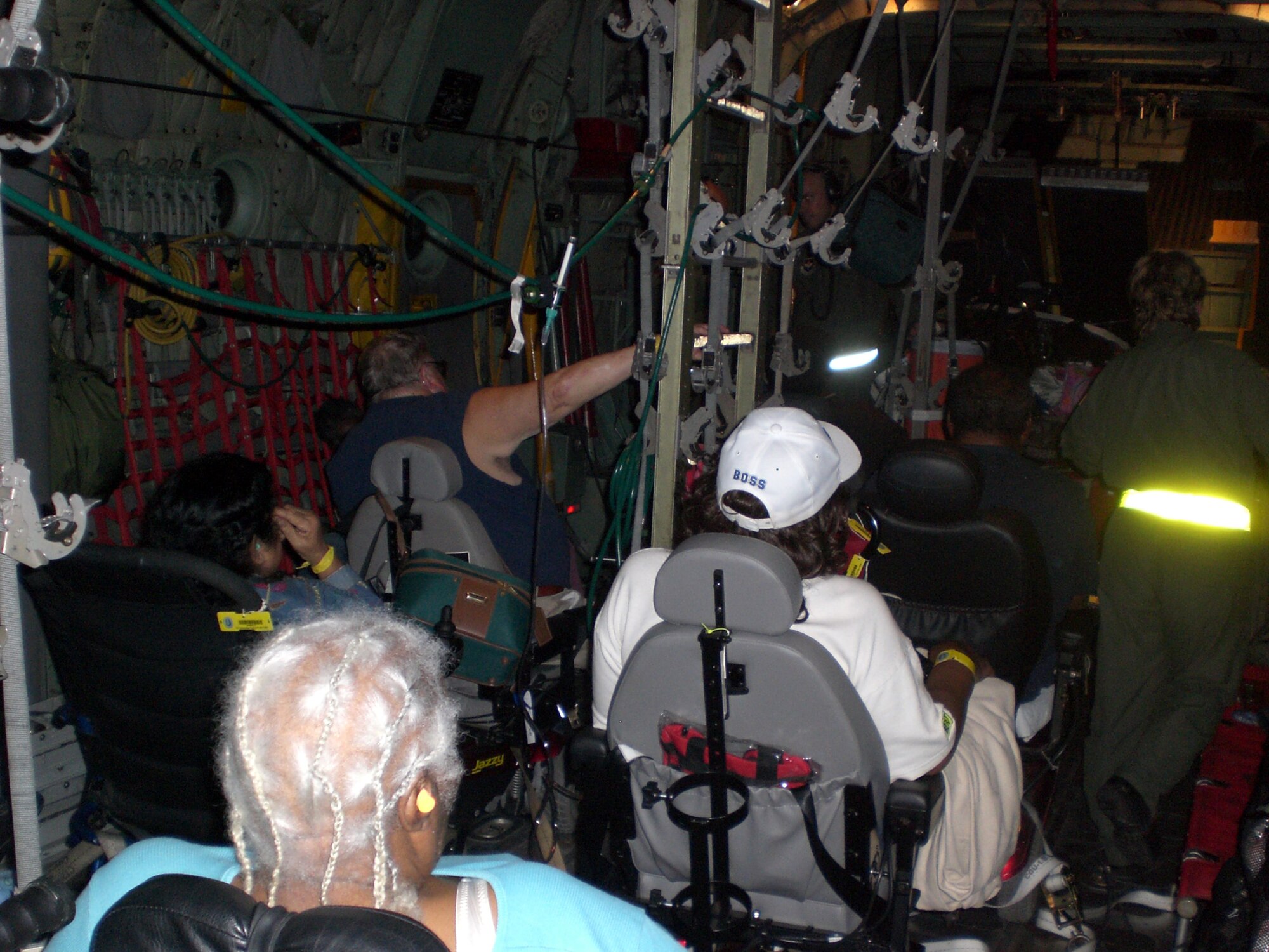 Patients on motorized wheelchairs are airlifted from hurricane areas. The 445th Aeromedical Evacuation Squadron provided support during two hurricanes and was an integral part of the safe movement of more than 400 people.  (Courtesy photo)